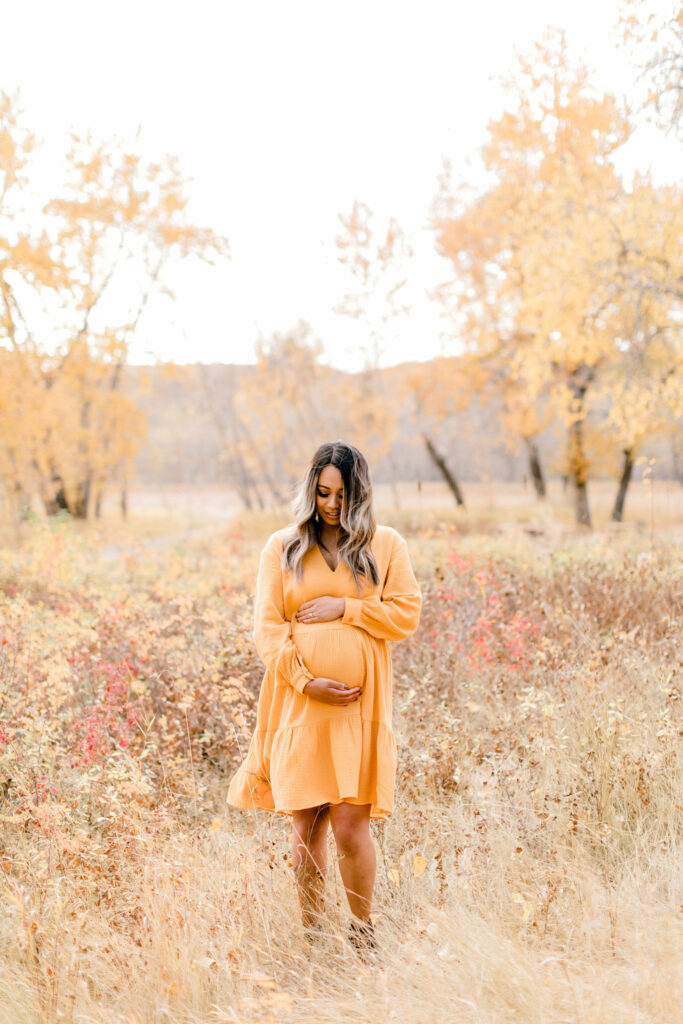 fall photos, maternity session, poses, fall outfits, yellow dress, orange dress, pregnant, pregnancy announcement, baby announcement, fall leaves, cute poses, romantic poses