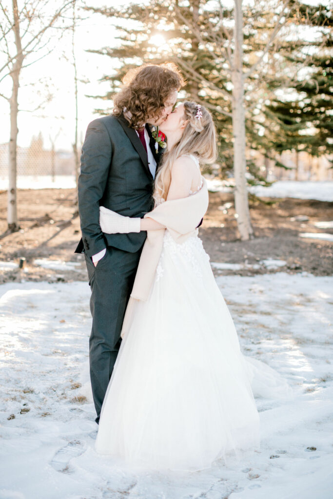 bride groom kissing, winter kiss, sunset snow photo