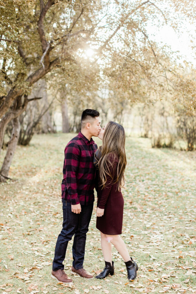 fall engagement, sunset fall, calgary wedding photographers, bow valley ranche, bow valley ranche restaurant, film engagement, film photography, engagement photographer, edmonton photographer, plaid engagement, red and black outfits, best wedding photographers alberta