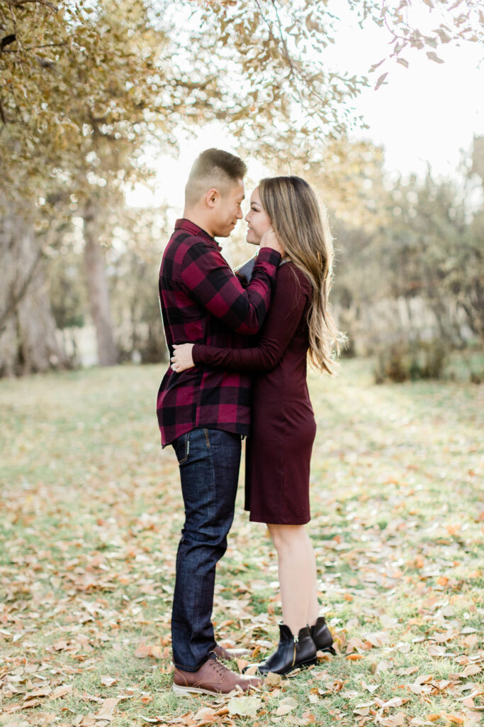 fall engagement, sunset fall, calgary wedding photographers, bow valley ranche, bow valley ranche restaurant, film engagement, film photography, engagement photographer, edmonton photographer, plaid engagement, red and black outfits, best wedding photographers alberta