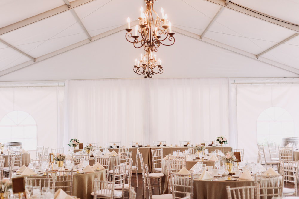 meadow muse, nicole sarah, tented wedding, white tent wedding, neutral tent wedding, blush, dusty miller, tent chandelier, draped tent, best wedding photographers, film photographers