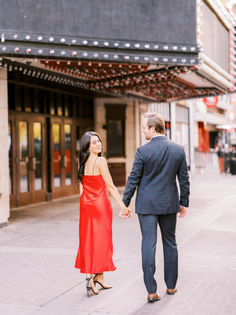 Hollywood Glam Downtown Engagement red dress, red dress engagement, urban engagement, hollywood glam, hollywood engagement, los angeles engagement style, twinkling lights engagement, romantic engagement session, coupe engagement, coupe glasses champagne, hollywood theatre, theatre engagement, hollywood theatre engagement, nicole sarah, stylish engagement session, engagement style, nicole sarah, film photographers, martha stewart weddings, glam hollywood, vintage hollywood style