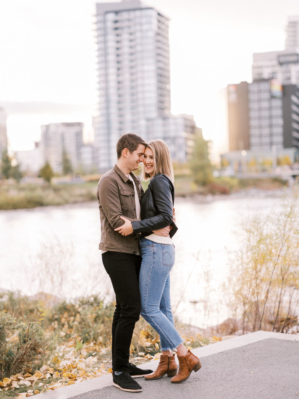 how to plan your engagement session, Fall East Village Engagement Nicole Sarah Photography, calgary wedding photographers, calgary wedding photographer, fall engagement, fall engagement outfits, fall engagement outfit ideas, engagement ideas, leather jacket, couple walking sunset, east village calgary, best wedding photographers canada, fun engagement photos, engagement poses romantic