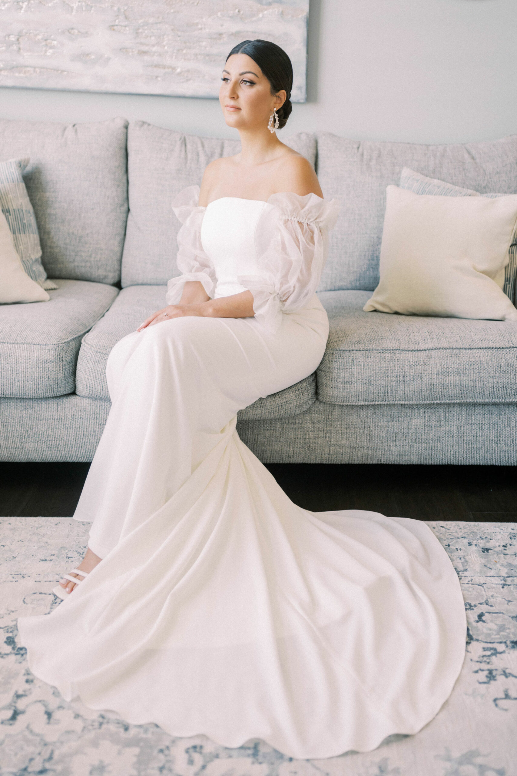 bridal portrait getting ready, bride sitting, couture gown, bridal gown accessories, sleeve attachment
