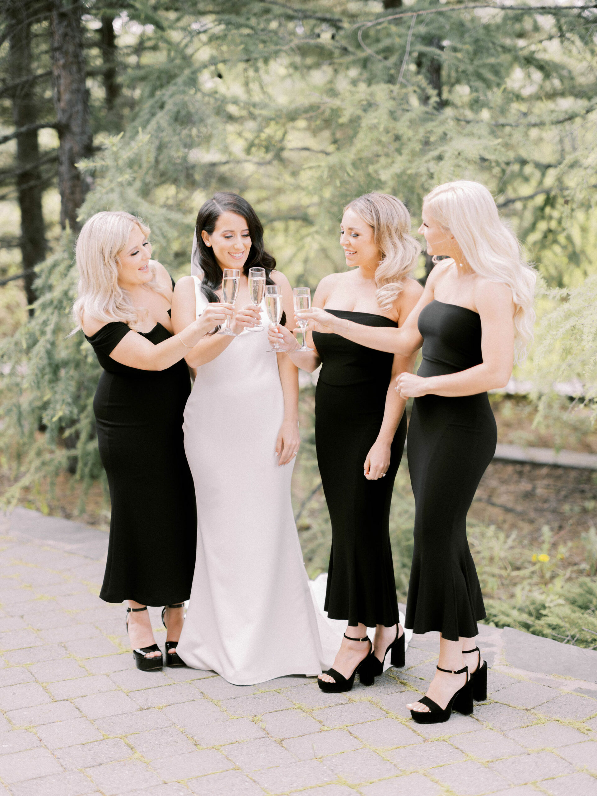 How to not go broke as a bridesmaid, bridesmaid tips, paying for a wedding, bridesmaids cheers with bride, toast to the bride, black bridesmaid dresses, black bridesmaid gowns, chic black tie bridesmaids