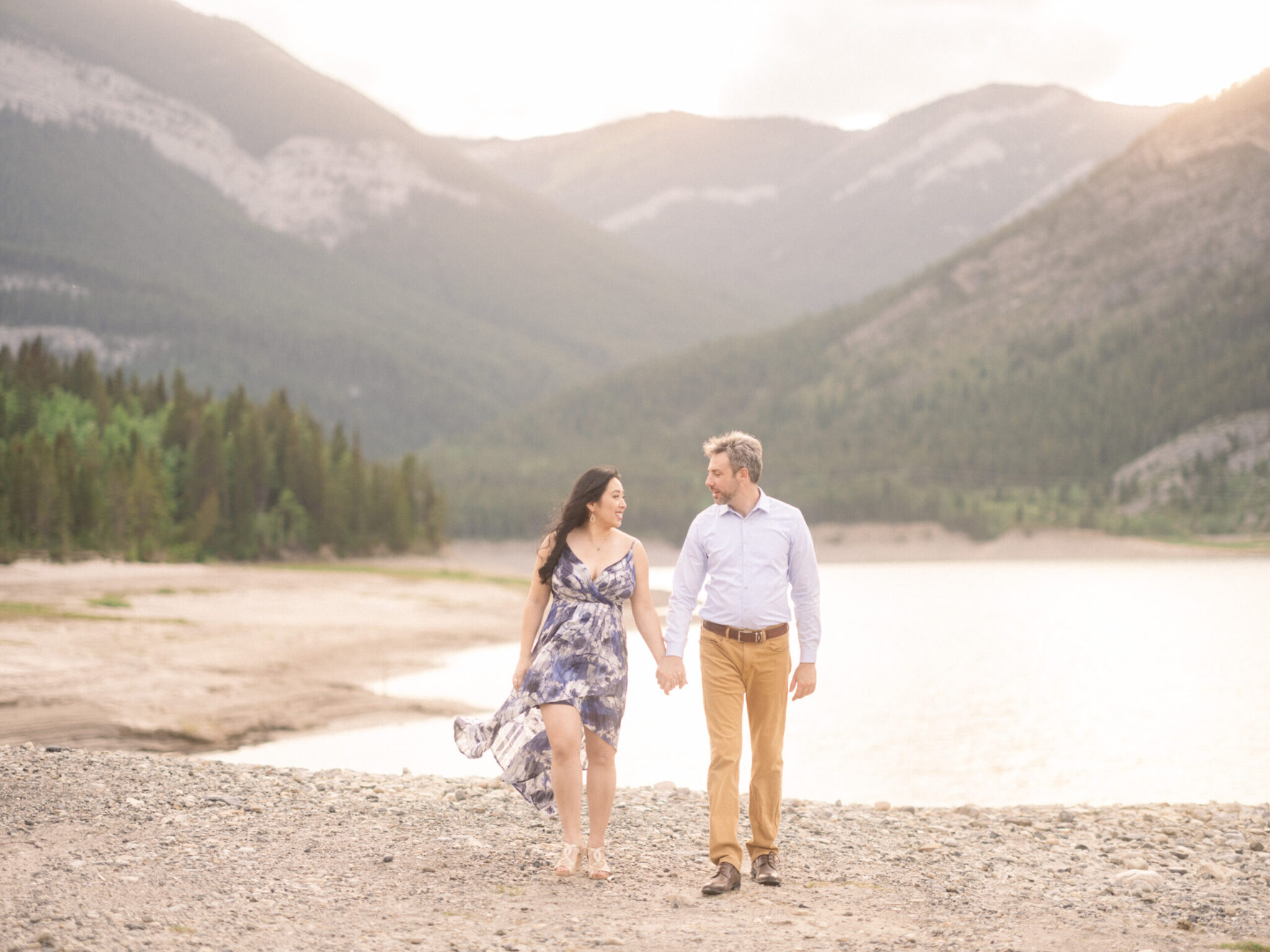 Dreamy Canmore Engagement Session, calgary wedding photographers, calgary engagement photographer, canmore banff wedding photographer, sunset engagement lake, couple walking on the beach, engagement at sunset, film photos of engagement