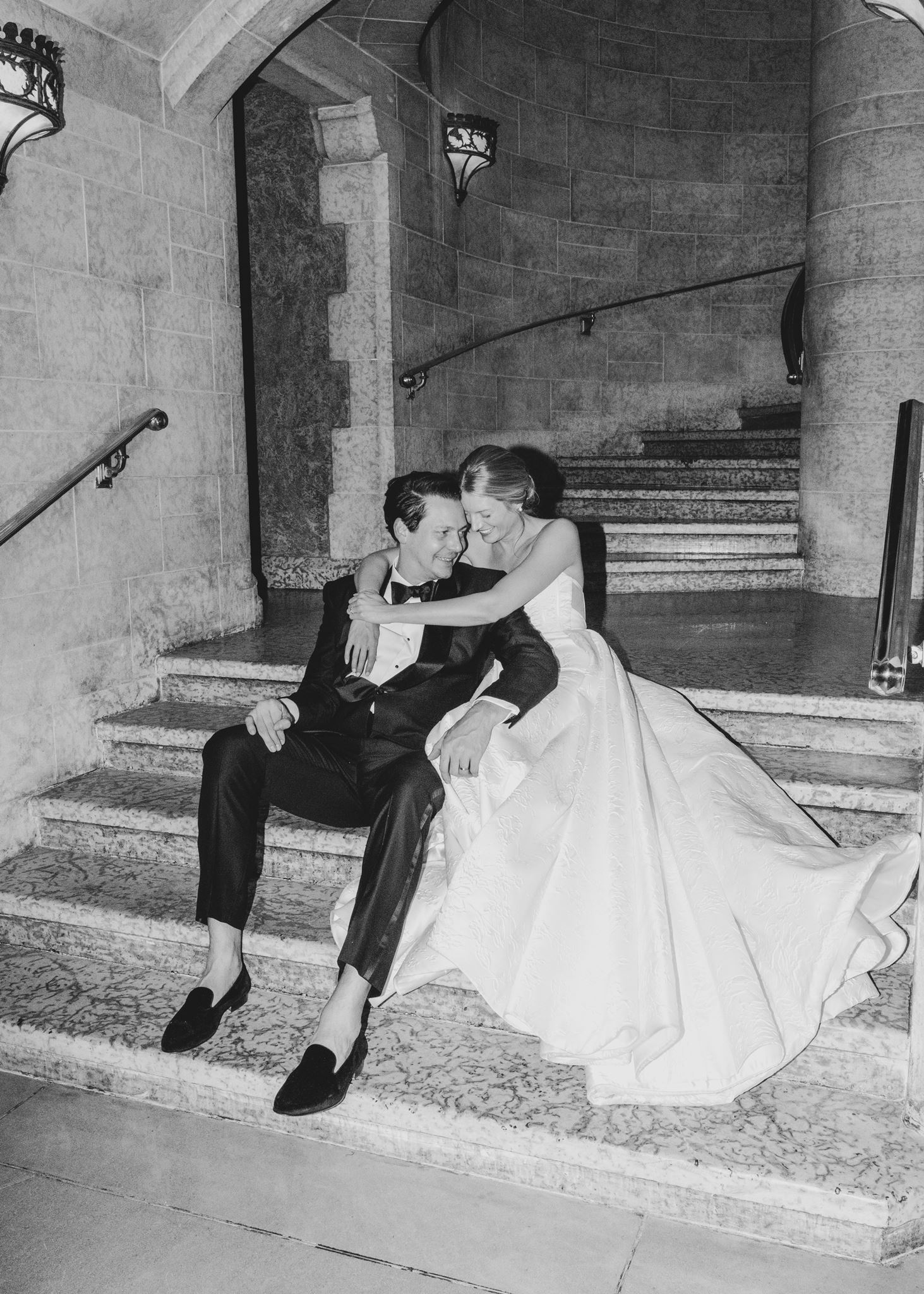 How to Choose an Editorial Wedding Photographer in Calgary, couple cuddling on stairs, black white editorial photo