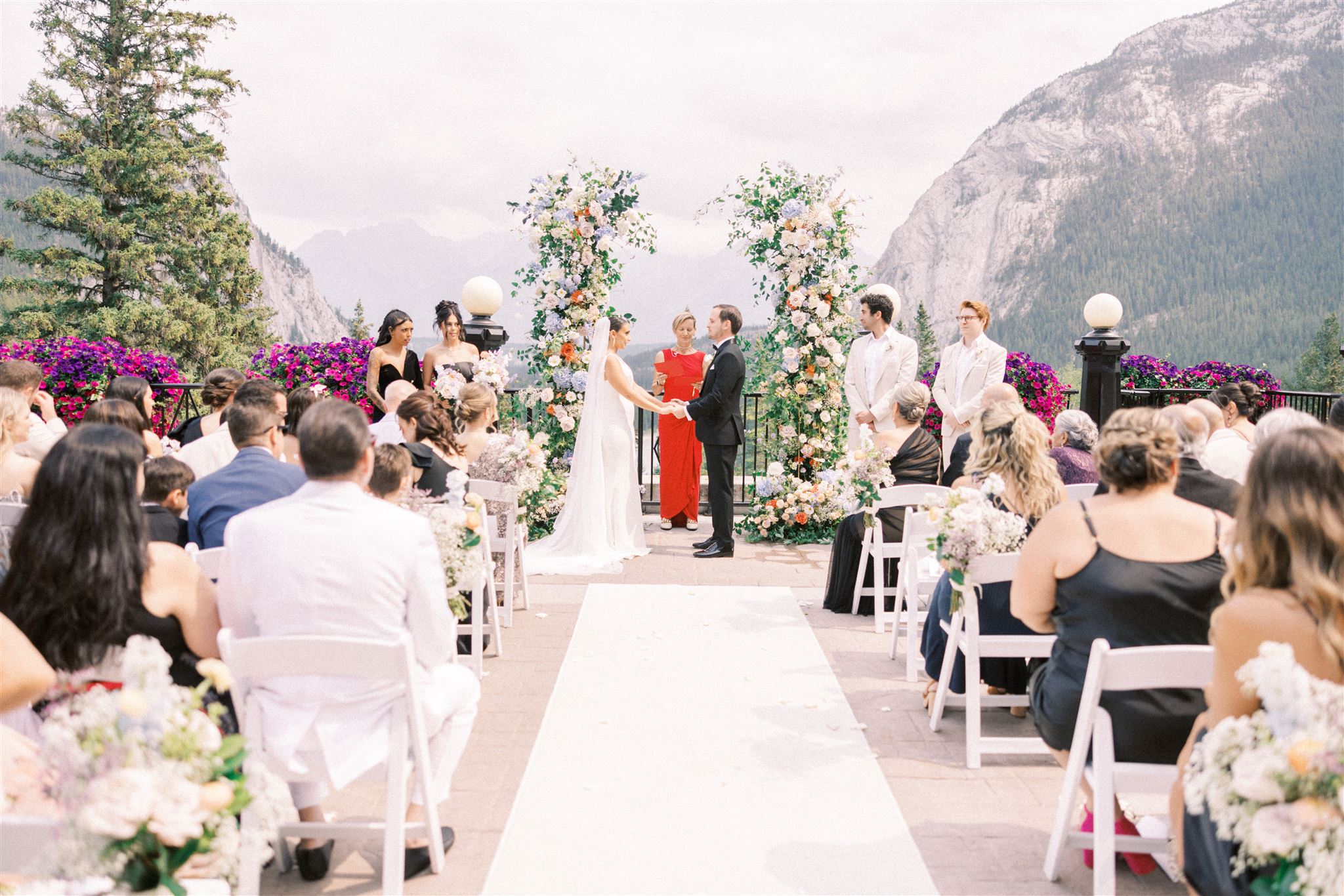 Vibrant Banff Springs Wedding Nicole Sarah, banff springs terrace wedding, terrace fairmont wedding ceremony, floral arch