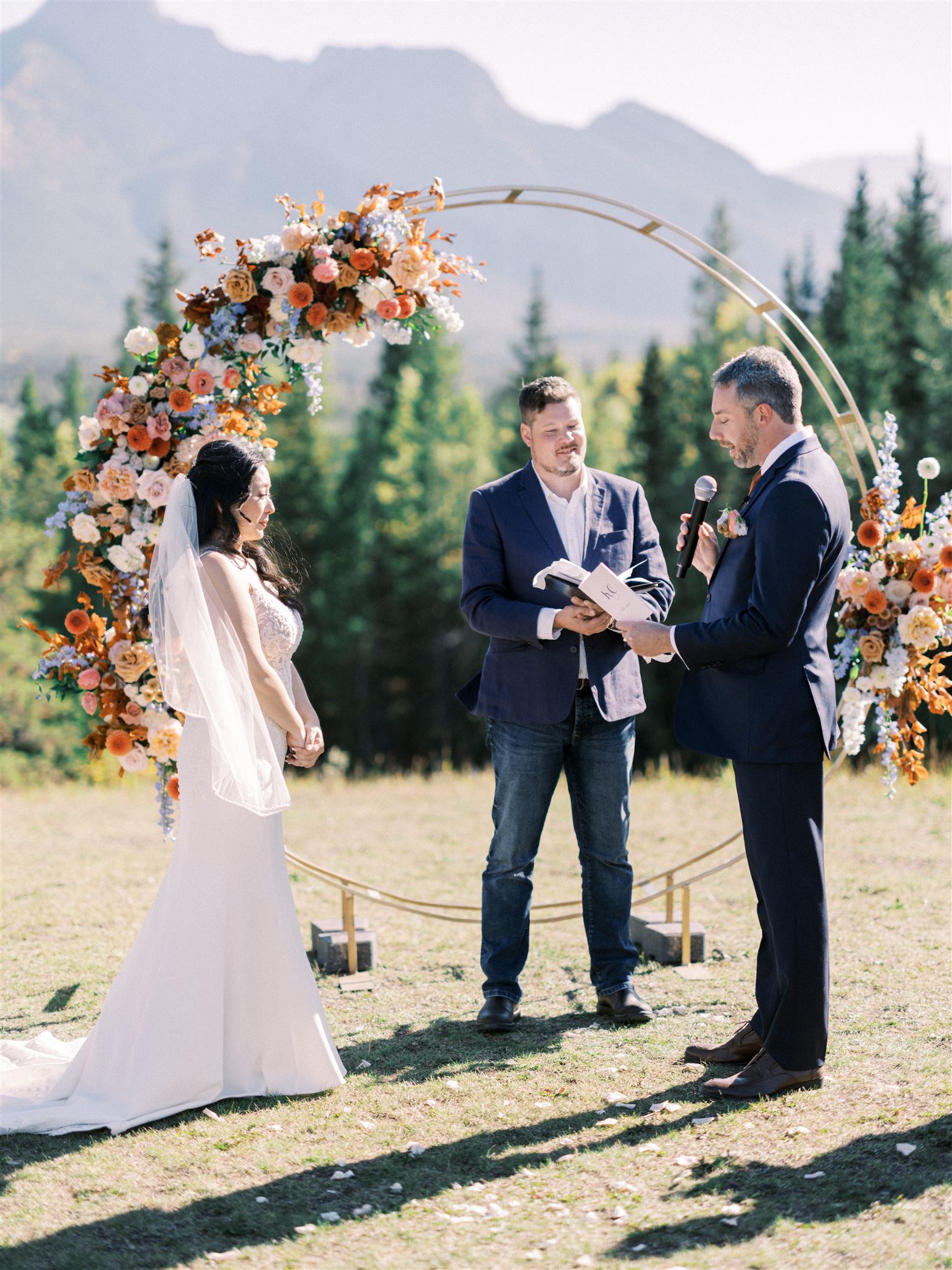 calgary wedding photographers, wedding ceremony, ceremony wedding arch, floral circle arch