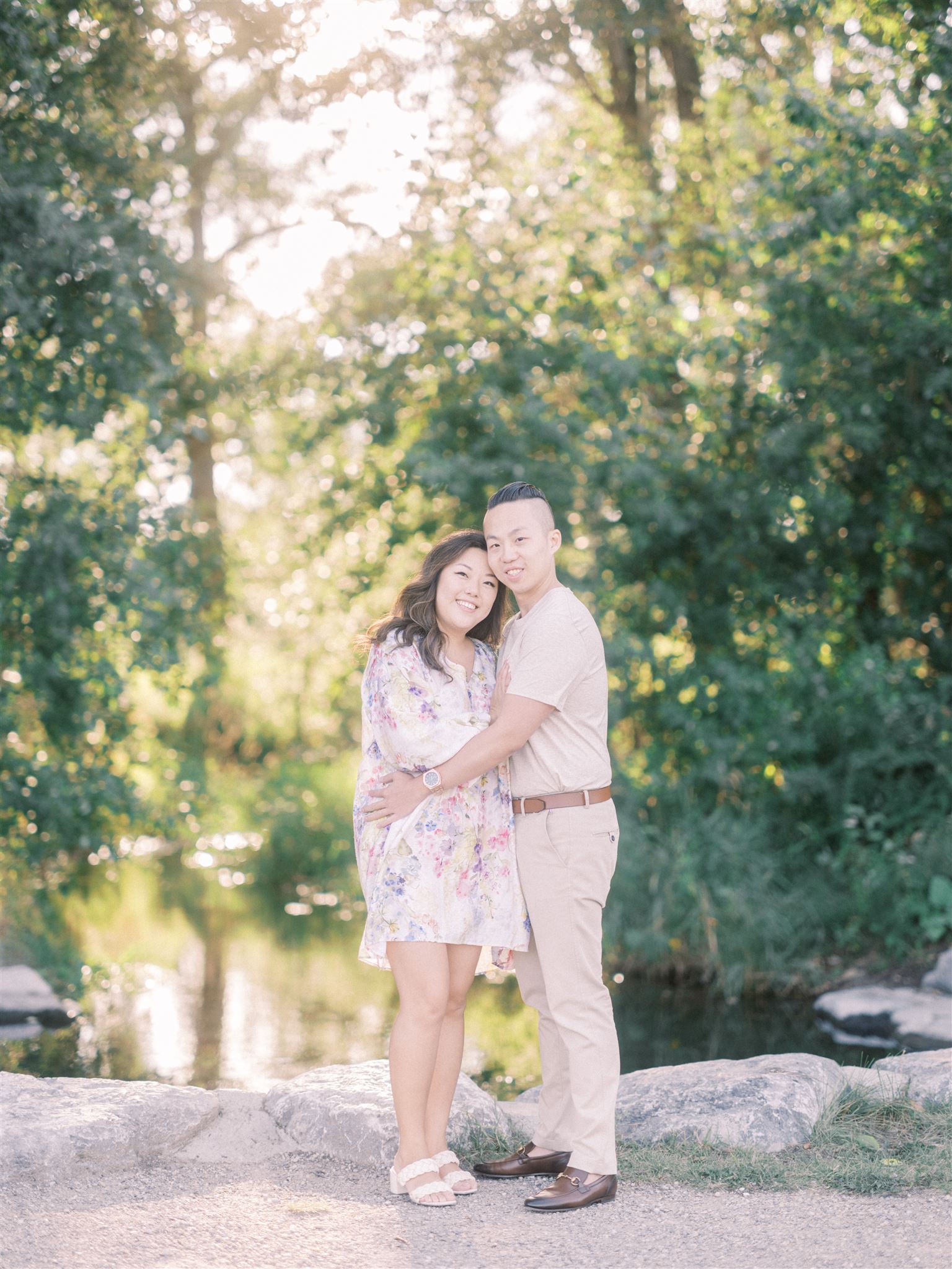 fun engagement poses, spring engagement, floral engagement dress, flower engagement dress, sunset engagement, editorial engagement photos, film engagement, film photography, best wedding photographers canada, flirty engagement poses