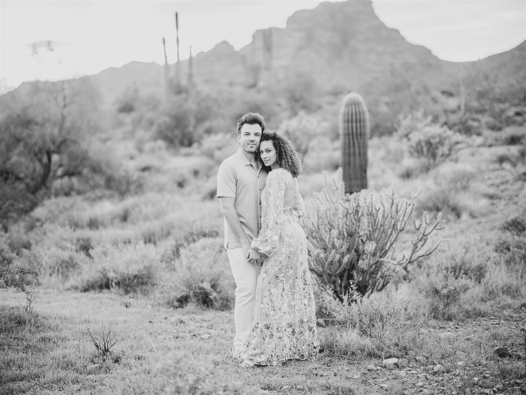 bride laughing, bride in white dress, white dress engagement, couple on cliff, couple snuggling, bright film engagement