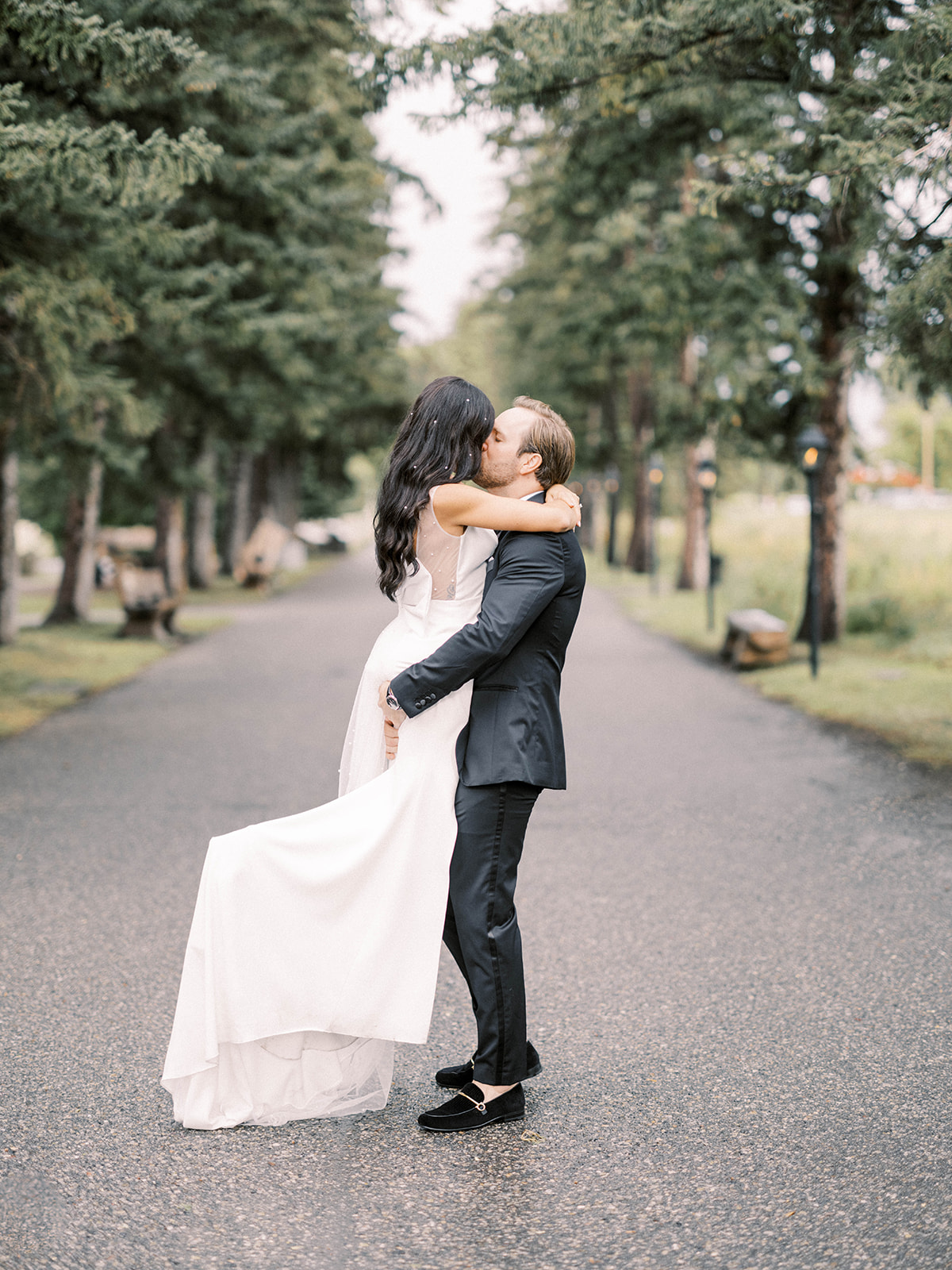 bow valley, italian wedding, couple walking away from camera, atelier by ensemble, custom wedding suit