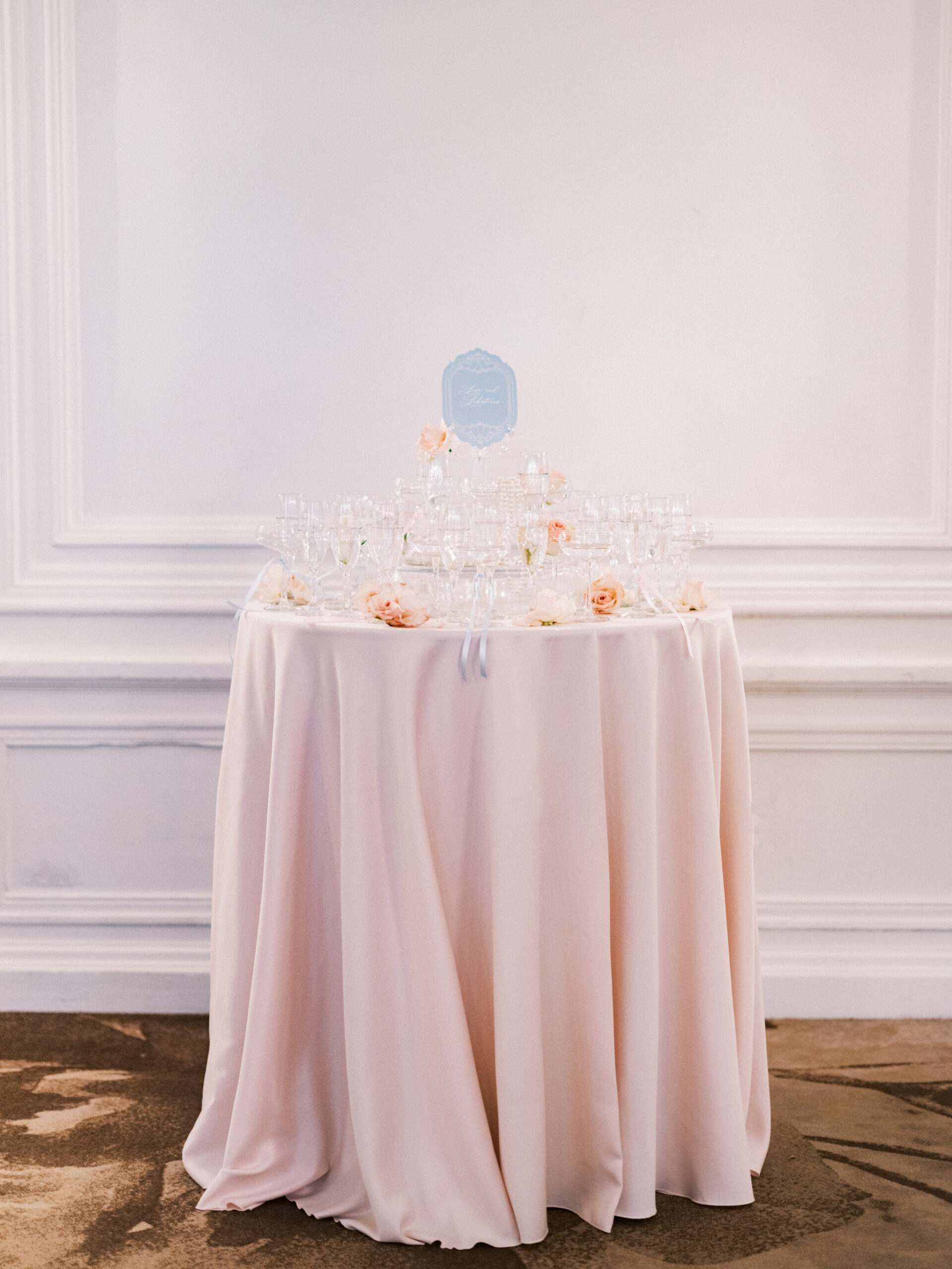 wedding table sign blue, Fairmont Palliser Calgary True to Hue, ballet wedding, ballet themed wedding, bride with ballet shoes, pointe ballet portrait, pointe ballet wedding, ballet inspired wedding day, fairmont weddings, nicole sarah photography, true to hue workshops, bride looking out window, bride in ballet shoes, pink pastel wedding, french pink wedding, best wedding photographers canada, edmonton wedding