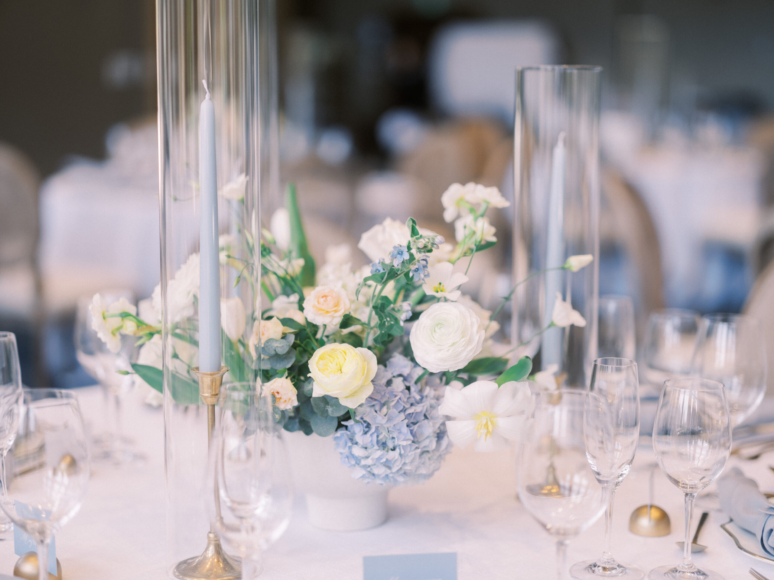 French Blue Parisian Wedding Inspiration, wedding ceremony hydrangeas roses, blue tapered candles wedding, gold cutlery, head table florals, bridal table flowers, hydrangea centrepieces, tall hydrangea centrepiece, blue ceremony arch, hydrangea ceremony arch, french wedding, light blue wedding, dusty blue florals, anemones, wedding floral inspo, blue wedding hydrangeas, nicole sarah wedding photography, gold trim wedding plates