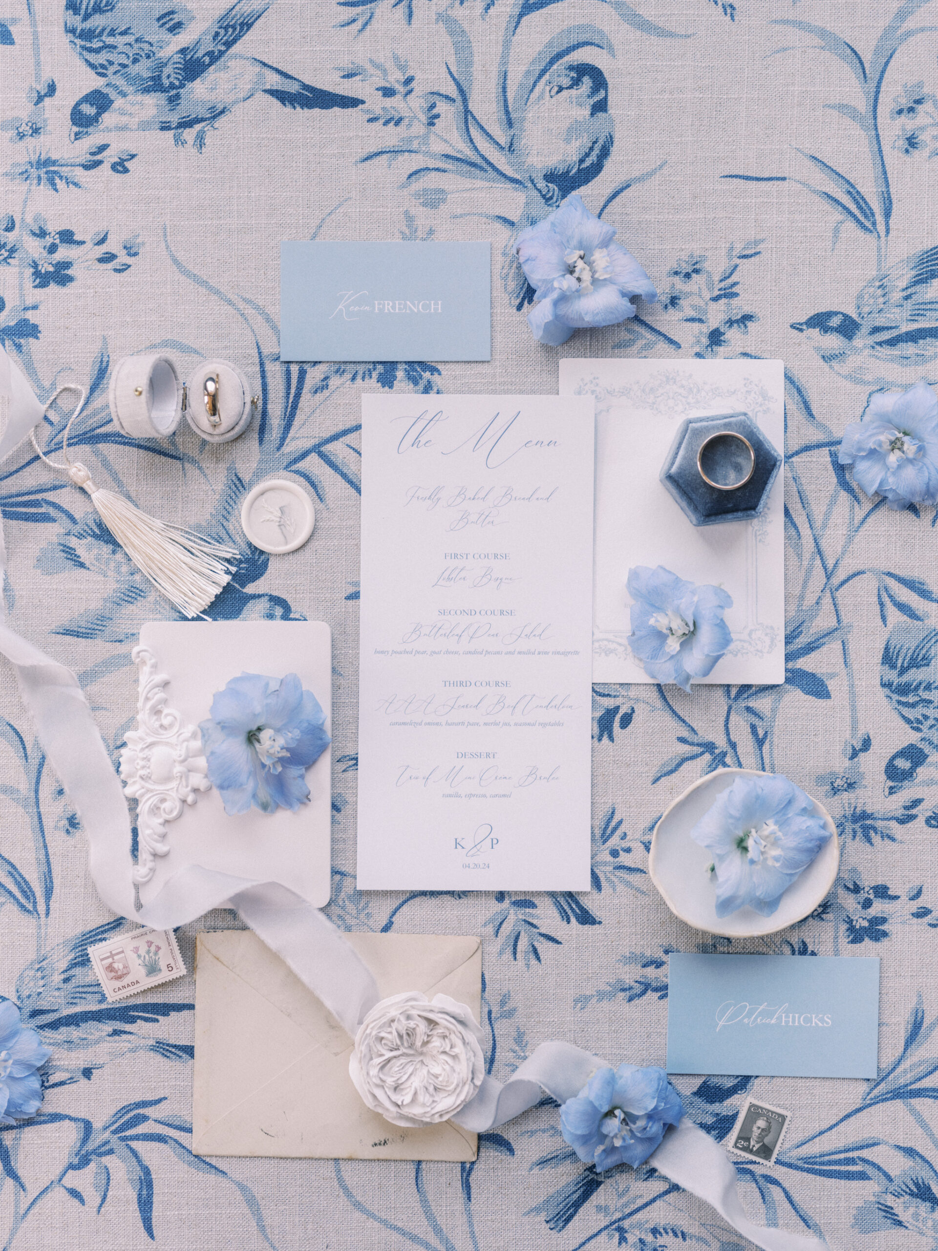 wedding flat lay french blue, wedding ceremony hydrangeas roses, blue tapered candles wedding, gold cutlery, head table florals, bridal table flowers, hydrangea centrepieces, tall hydrangea centrepiece, blue ceremony arch, hydrangea ceremony arch, french wedding, light blue wedding, dusty blue florals, anemones, wedding floral inspo, blue wedding hydrangeas, nicole sarah wedding photography, gold trim wedding plates