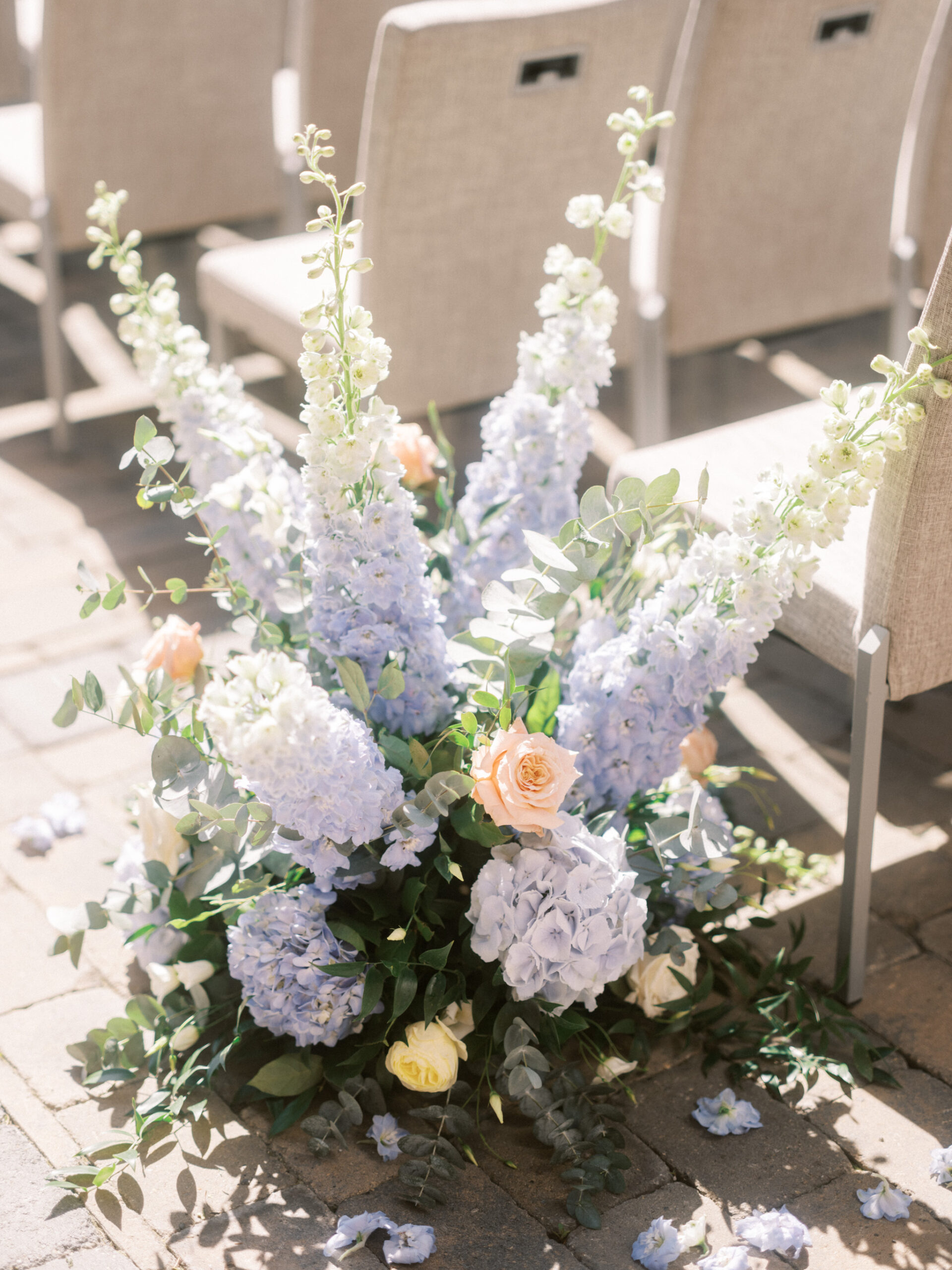 French Blue Parisian Wedding Inspiration, wedding ceremony hydrangeas roses, blue tapered candles wedding, gold cutlery, head table florals, bridal table flowers, hydrangea centrepieces, tall hydrangea centrepiece, blue ceremony arch, hydrangea ceremony arch, french wedding, light blue wedding, dusty blue florals, anemones, wedding floral inspo, blue wedding hydrangeas, nicole sarah wedding photography, gold trim wedding plates