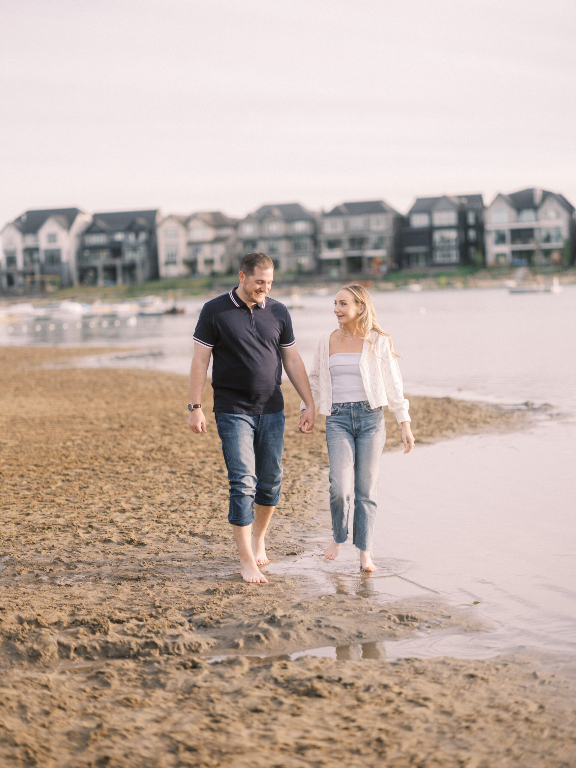 Summer beach engagement, couple walking down the beach, running on beach bride, running beach engagement, bride on the beach, romantic beach photos, romantic beach photography, nicole sarah photography, mahogany beach club, mahogany family photographer, couple cuddling on the beach, engagement wardrobe beach inspiration