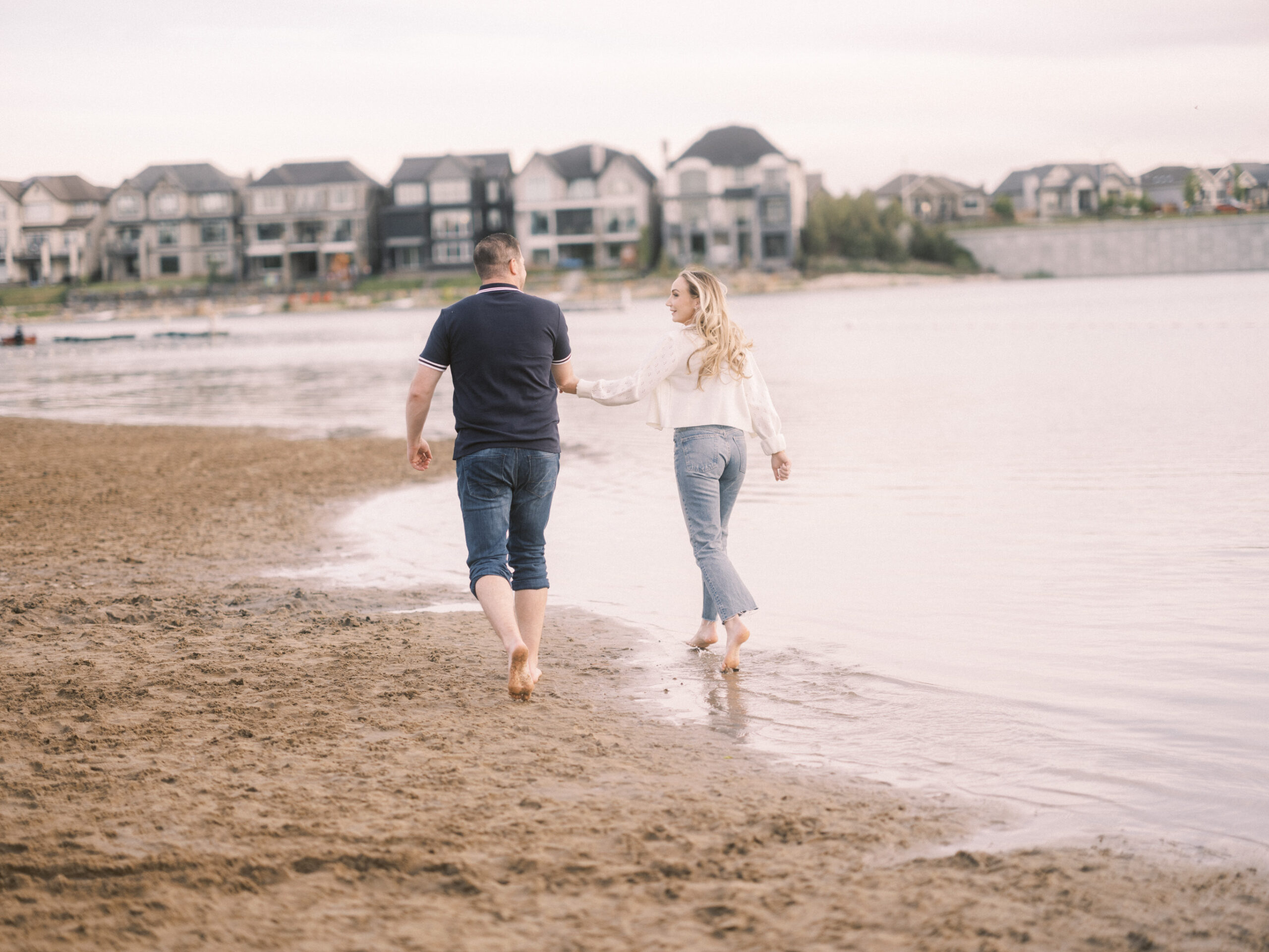 Summer beach engagement, couple walking down the beach, running on beach bride, running beach engagement, bride on the beach, romantic beach photos, romantic beach photography, nicole sarah photography, mahogany beach club, mahogany family photographer, couple cuddling on the beach, engagement wardrobe beach inspiration