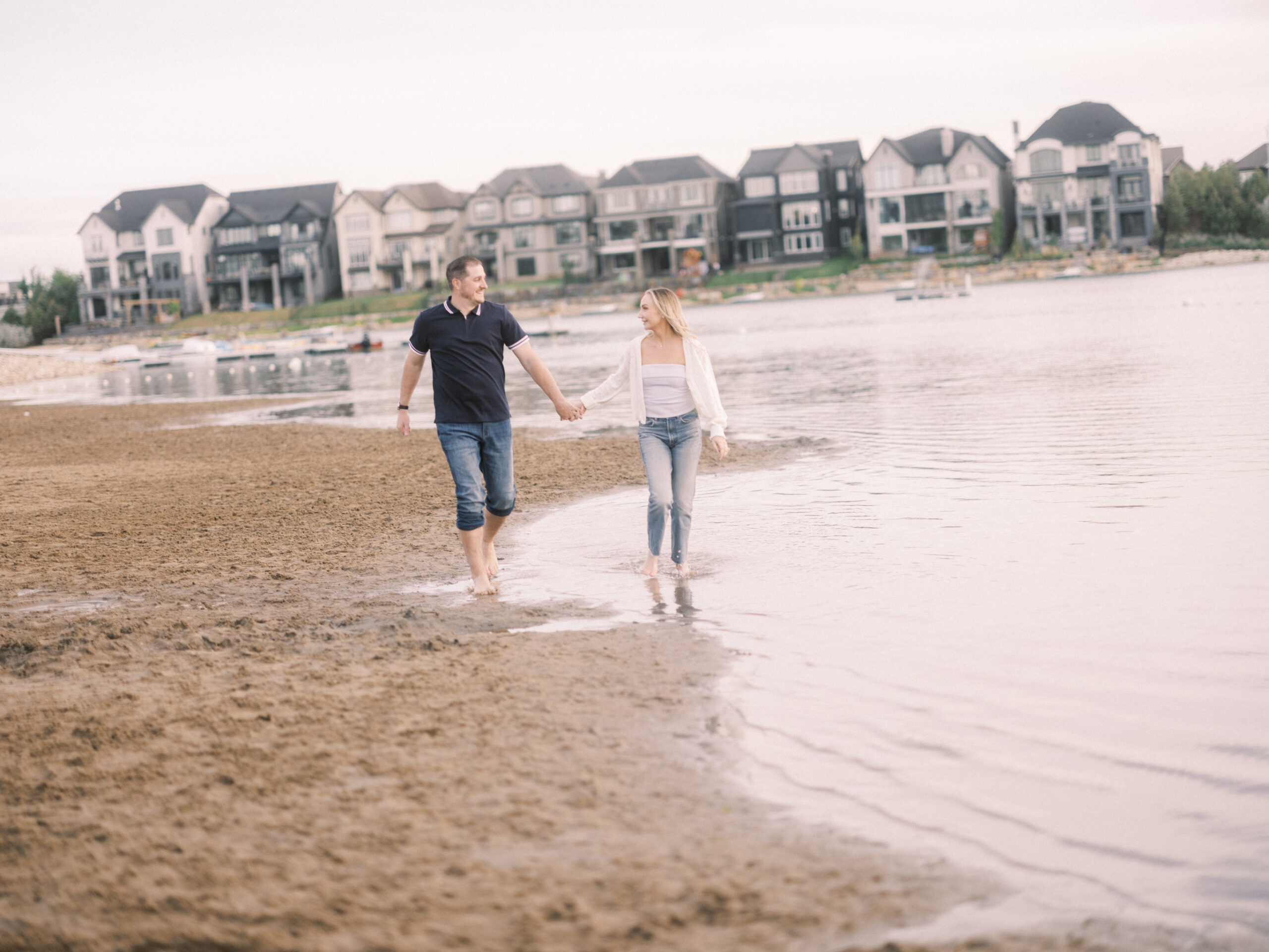 Summer beach engagement, couple walking down the beach, running on beach bride, running beach engagement, bride on the beach, romantic beach photos, romantic beach photography, nicole sarah photography, mahogany beach club, mahogany family photographer, couple cuddling on the beach, engagement wardrobe beach inspiration