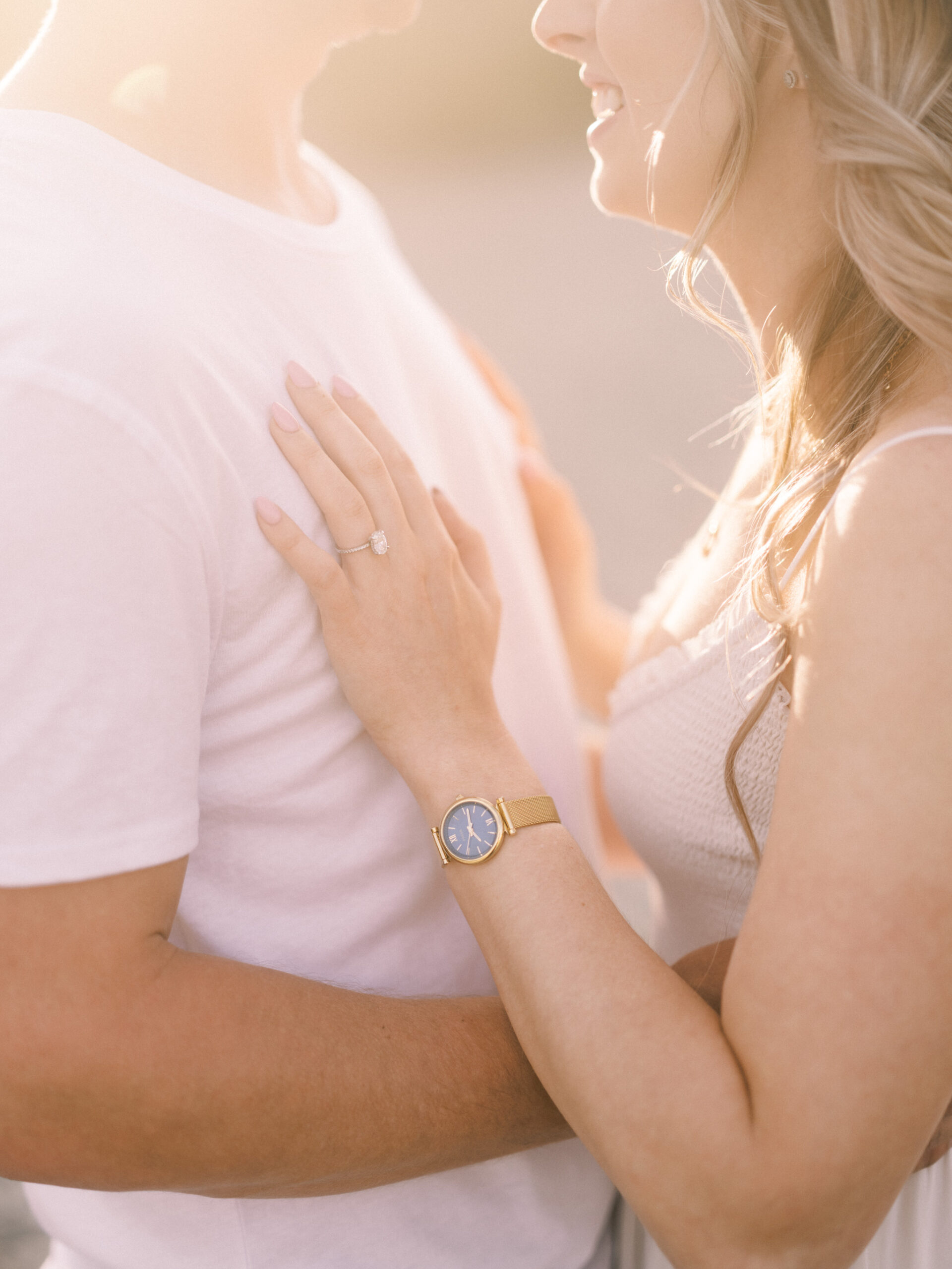 Cherry Blossom Spring Engagement Session, river engagement couple laughing, couple embracing, engagement pose sunset, sunset engagement photos, labrador retriever engagement photos, dog engagement session, puppy engagement session, alberta wedding photographers, alberta photographer, calgary wedding, calgary wedding photographer, spring engagement session, spring photos, nicole sarah, cherry blossom photos, cherry blossom engagement, wedding poses, white dress engagement, sundress white, engagement photos, bow river, puppy engagement photos, neutral engagement photos