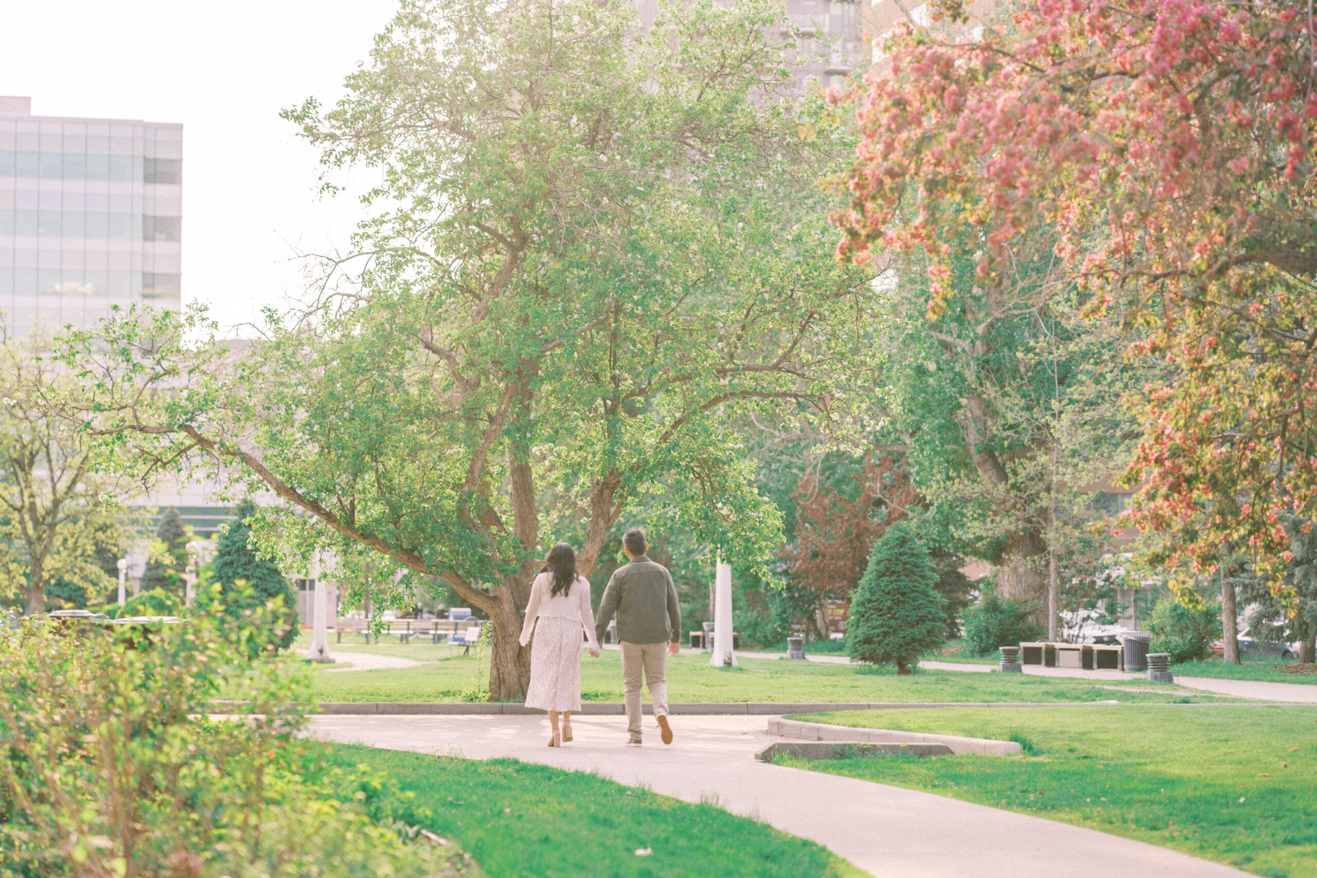 Urban Calgary Engagement Session, Central memorial library, sunset urban engagement, nicole sarah engagemet, affordable wedding photographers, award winning wedding photographers, film wedding photographers, couple laughing and dancing in park, engagement inspiration, nicole sarah, engagement session, engagement wardrobe, arizona wedding photographer, alberta wedding photographers