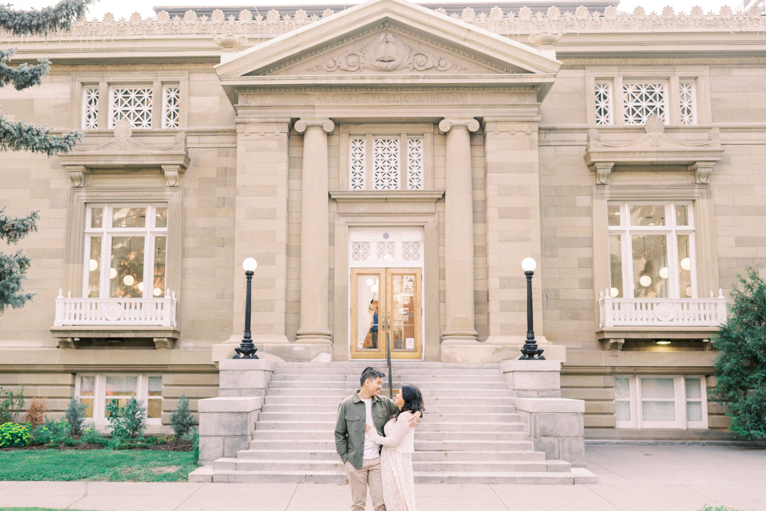 Urban Calgary Engagement Session, Central memorial library, sunset urban engagement, nicole sarah engagemet, affordable wedding photographers, award winning wedding photographers, film wedding photographers, couple laughing and dancing in park, engagement inspiration, nicole sarah, engagement session, engagement wardrobe, arizona wedding photographer, alberta wedding photographers