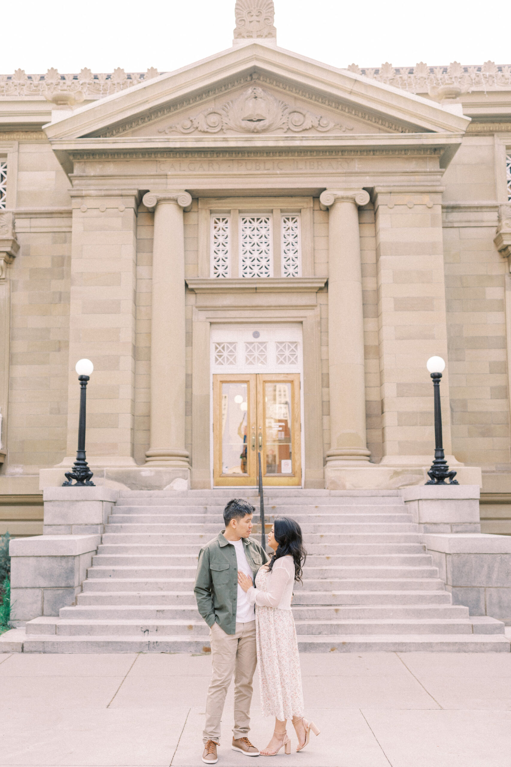 Urban Calgary Engagement Session, Central memorial library, sunset urban engagement, nicole sarah engagemet, affordable wedding photographers, award winning wedding photographers, film wedding photographers, couple laughing and dancing in park, engagement inspiration, nicole sarah, engagement session, engagement wardrobe, arizona wedding photographer, alberta wedding photographers