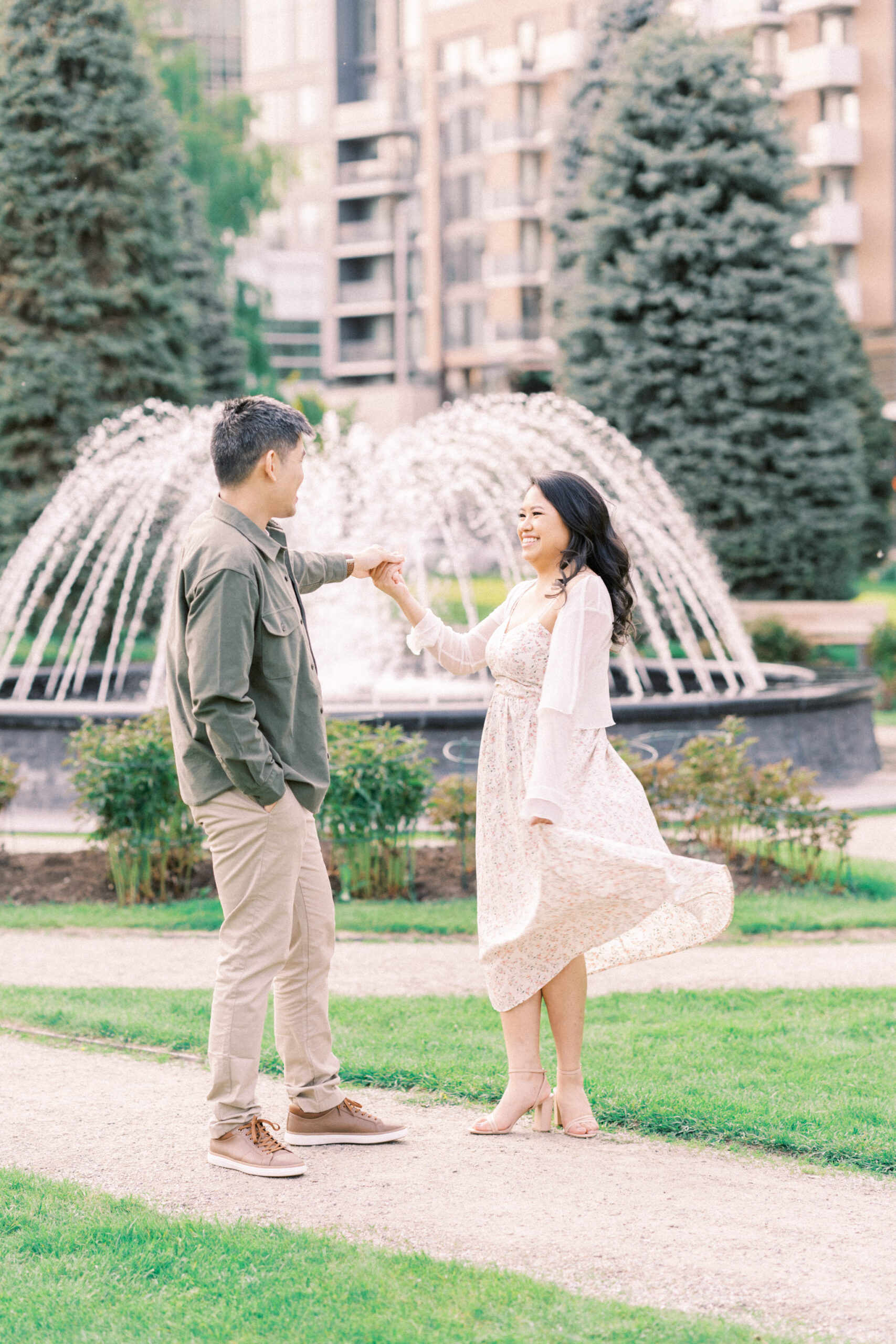 Urban Calgary Engagement Session, Central memorial library, sunset urban engagement, nicole sarah engagemet, affordable wedding photographers, award winning wedding photographers, film wedding photographers, couple laughing and dancing in park, engagement inspiration, nicole sarah, engagement session, engagement wardrobe, arizona wedding photographer, alberta wedding photographers