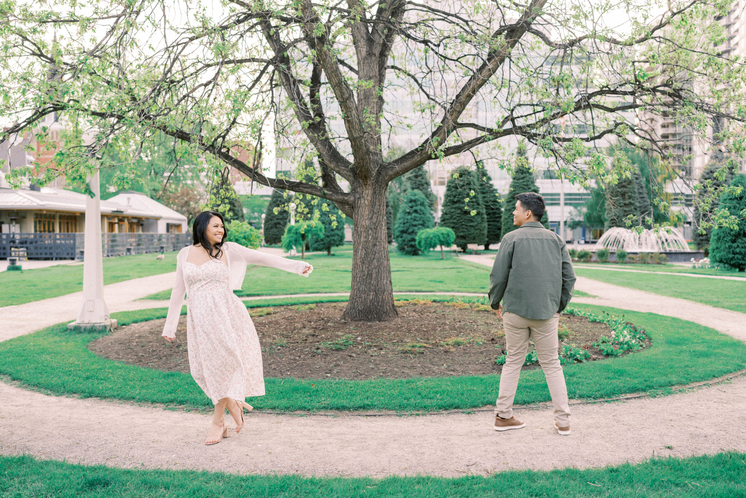 Urban Calgary Engagement Session, Central memorial library, sunset urban engagement, nicole sarah engagemet, affordable wedding photographers, award winning wedding photographers, film wedding photographers, couple laughing and dancing in park, engagement inspiration, nicole sarah, engagement session, engagement wardrobe, arizona wedding photographer, alberta wedding photographers