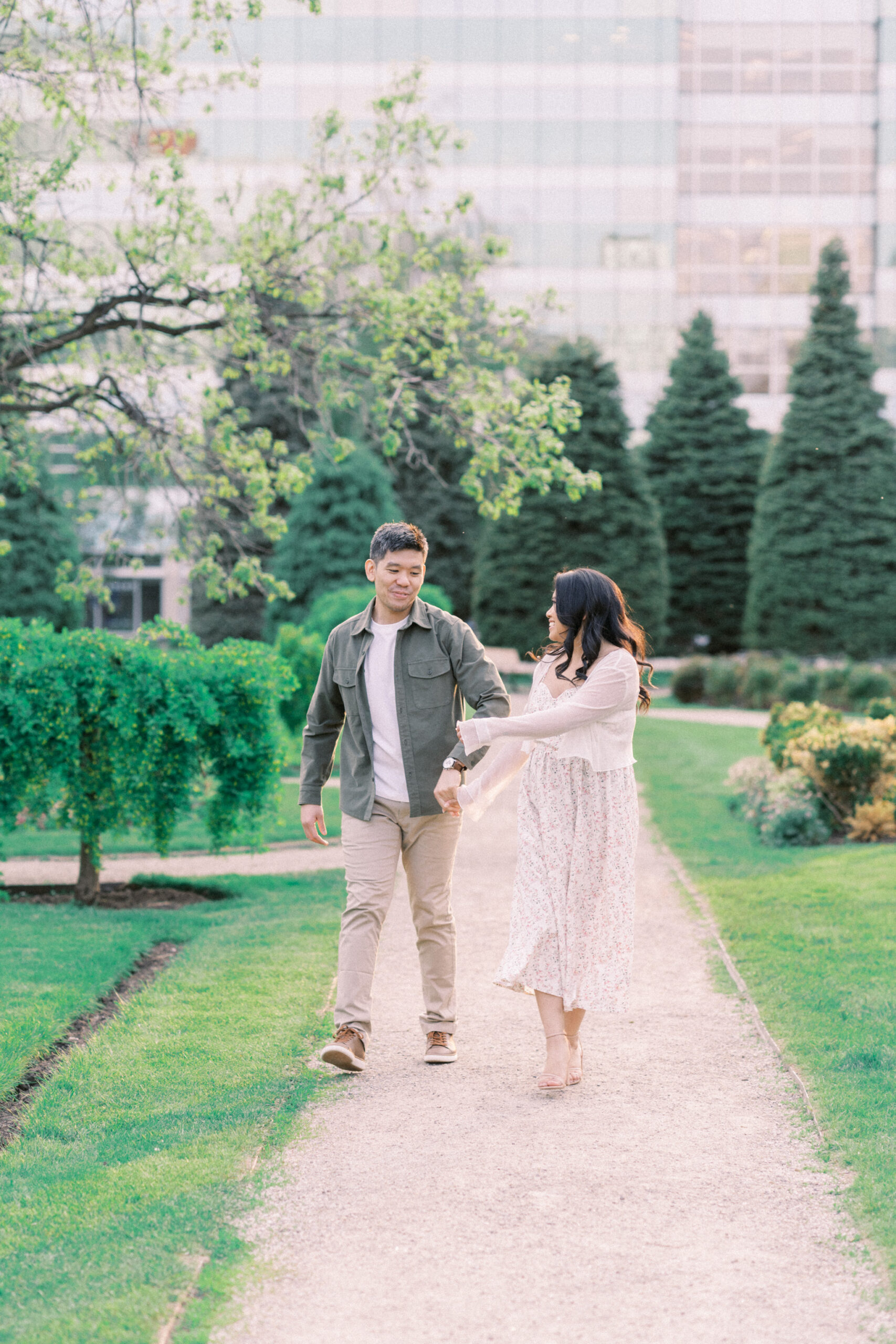 Urban Calgary Engagement Session, Central memorial library, sunset urban engagement, nicole sarah engagemet, affordable wedding photographers, award winning wedding photographers, film wedding photographers, couple laughing and dancing in park, engagement inspiration, nicole sarah, engagement session, engagement wardrobe, arizona wedding photographer, alberta wedding photographers