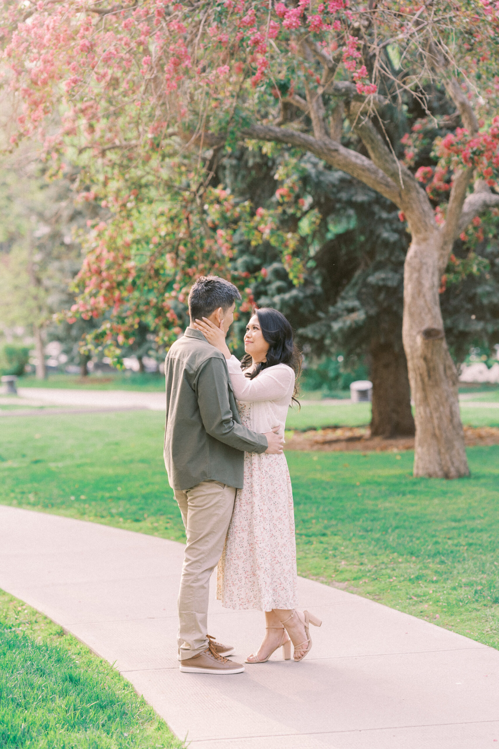 Urban Calgary Engagement Session, Central memorial library, sunset urban engagement, nicole sarah engagemet, affordable wedding photographers, award winning wedding photographers, film wedding photographers, couple laughing and dancing in park, engagement inspiration, nicole sarah, engagement session, engagement wardrobe, arizona wedding photographer, alberta wedding photographers