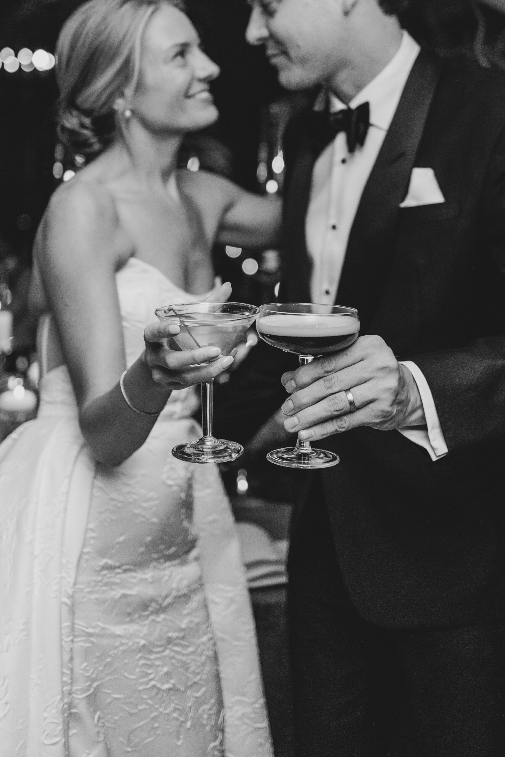 bride holding martini, flash black white photo, fairmont banff springs wedding, luxury wedding, destination wedding photographer nicole sarah, ralph lauren polo bar wedding, winter wedding, mountain wedding, rocky mountain weddings