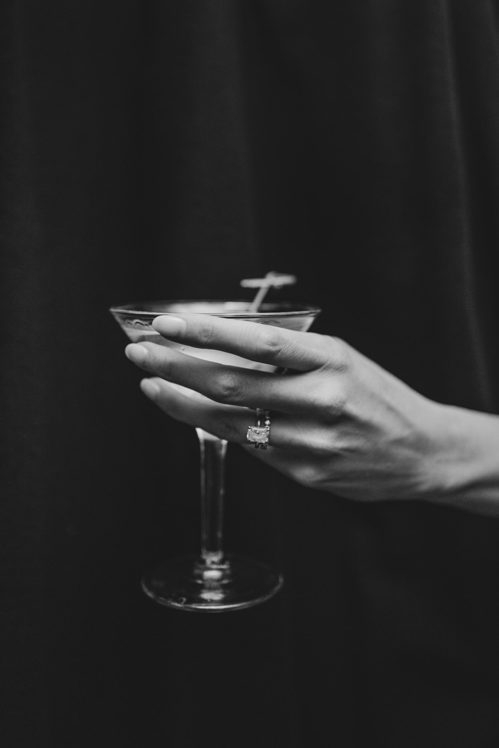 bride holding martini, flash black white photo, fairmont banff springs wedding, luxury wedding, destination wedding photographer nicole sarah, ralph lauren polo bar wedding, winter wedding, mountain wedding, rocky mountain weddings