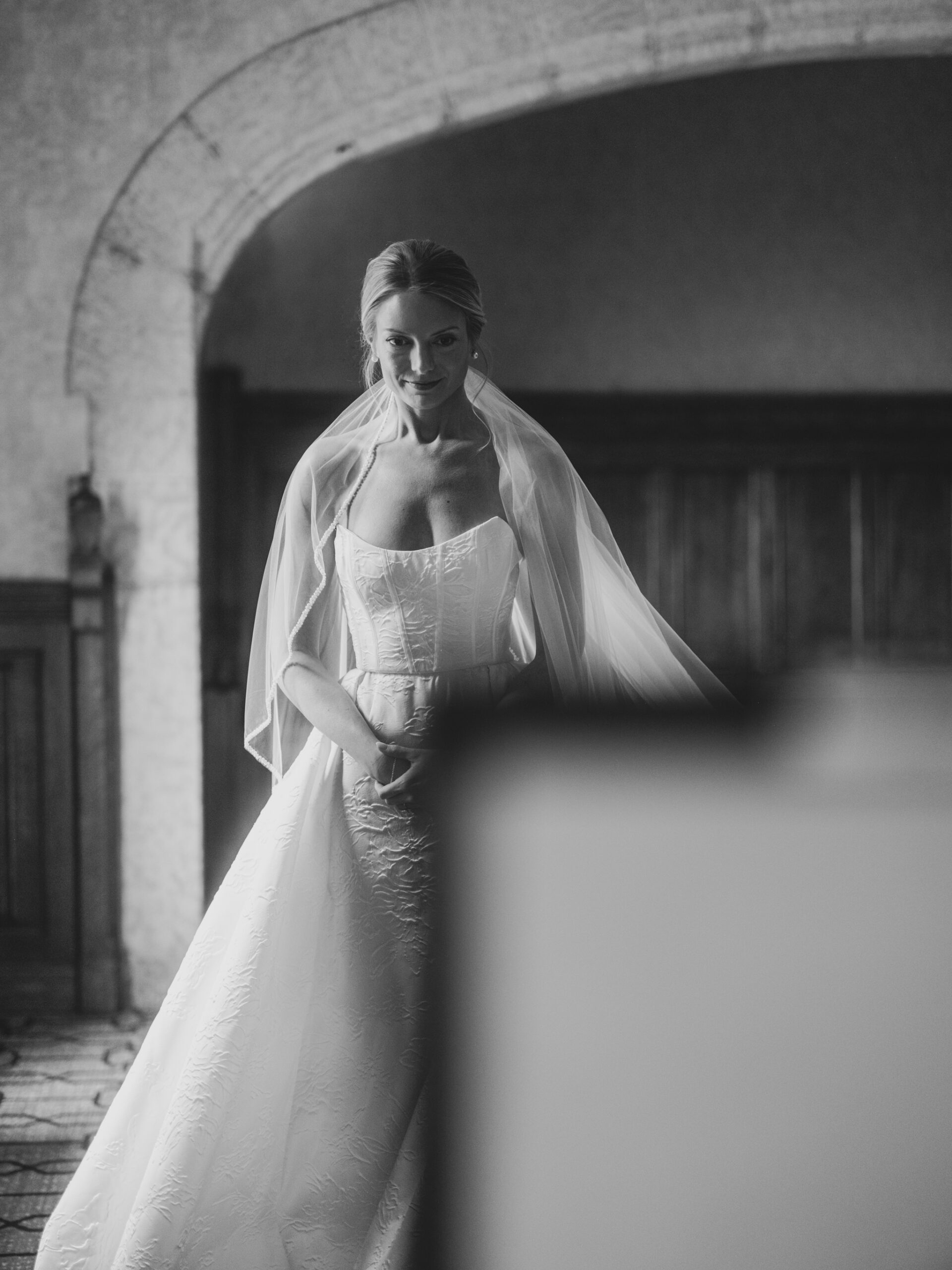 bride, looking in mirror, bride getting ready, black white, fairmont banff springs wedding, luxury wedding, destination wedding photographer nicole sarah, ralph lauren polo bar wedding, winter wedding, mountain wedding, rocky mountain weddings