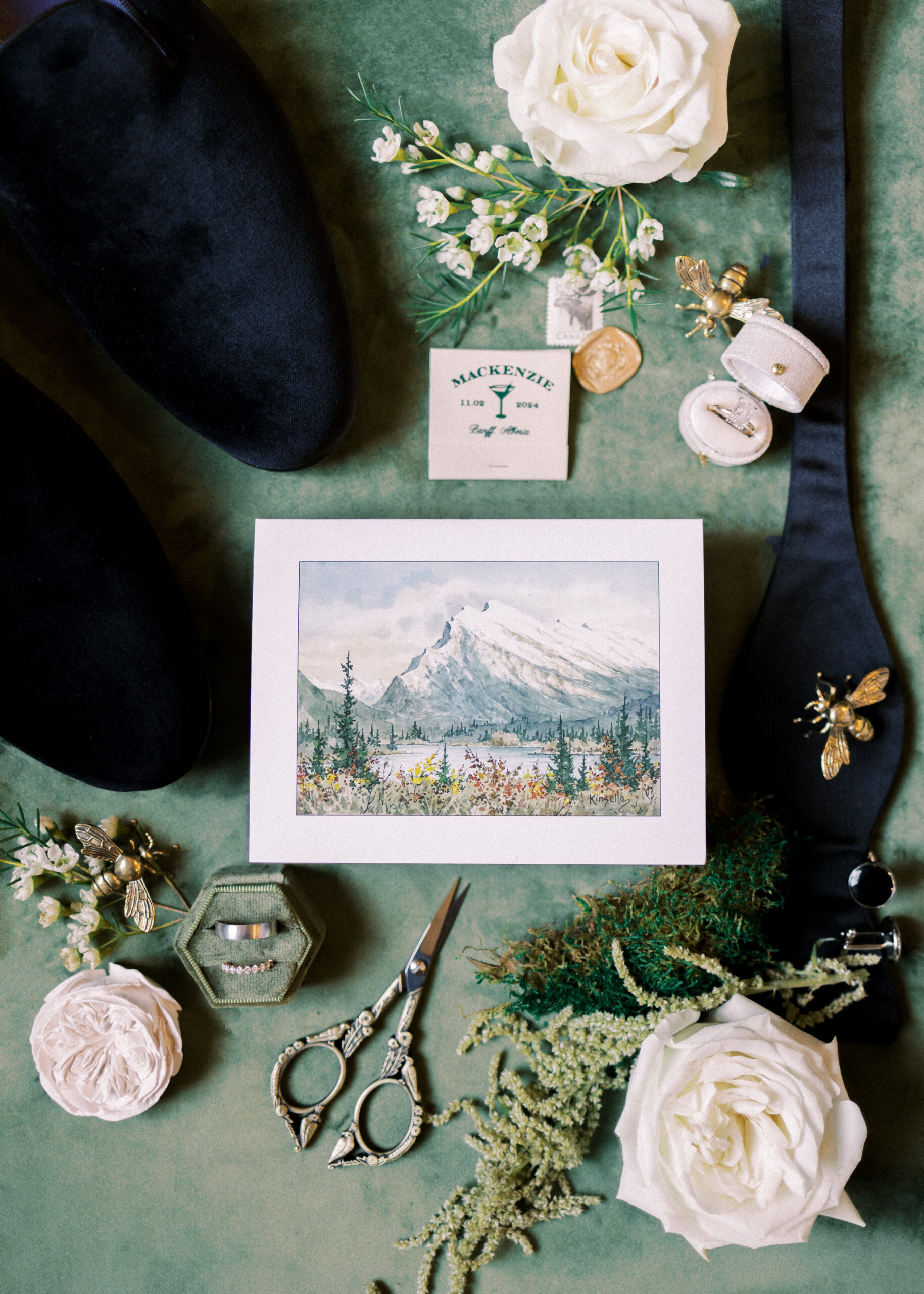 groom flat lay, wedding flat lay green, green velvet flat lay, fairmont banff springs wedding, luxury wedding, destination wedding photographer nicole sarah, ralph lauren polo bar wedding, winter wedding, mountain wedding, rocky mountain weddings