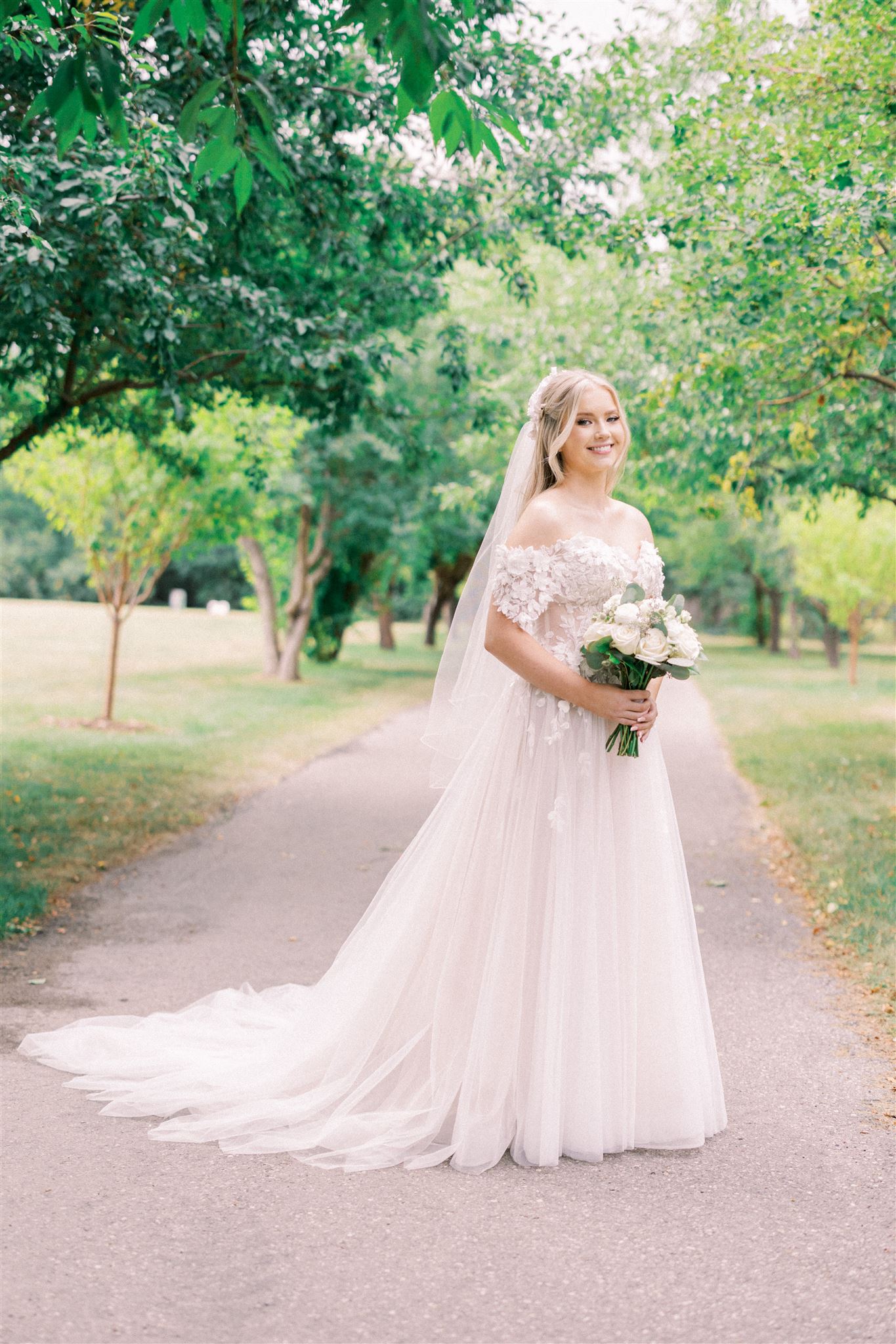 Waterfront Park Summer Calgary Wedding, lace wedding dress, nicole sarah, film wedding photography, film wedding photos, luxury wedding photographer calgary, romantic wedding portraits, alberta wedding photographers, lush greenery wedding photography, bride groom poses