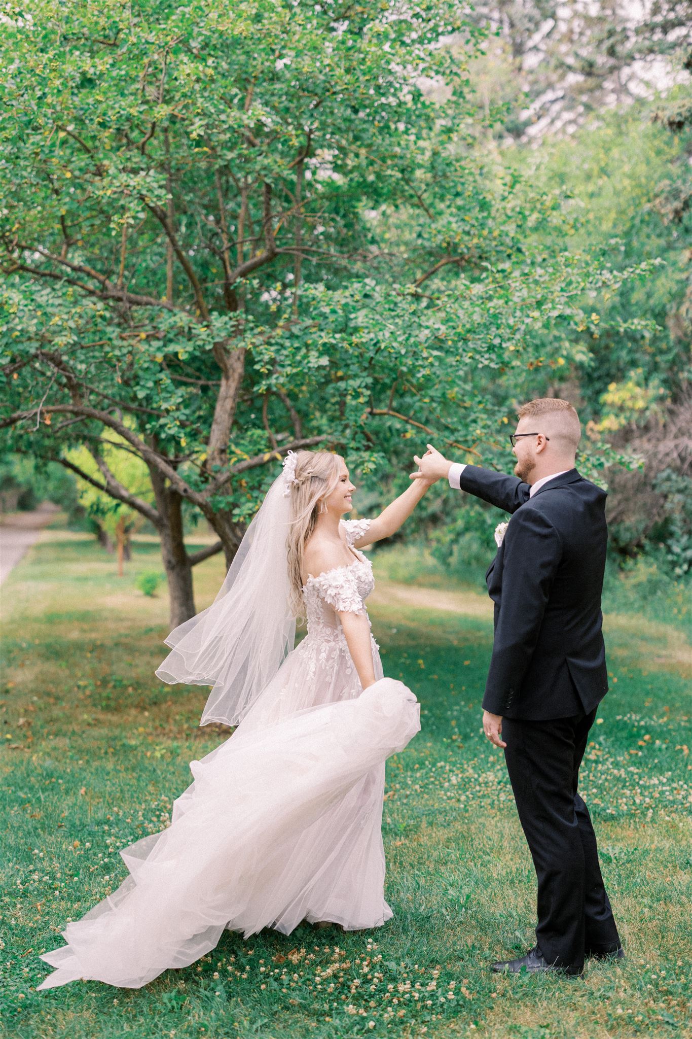 Waterfront Park Summer Calgary Wedding, lace wedding dress, nicole sarah, film wedding photography, film wedding photos, luxury wedding photographer calgary, romantic wedding portraits, alberta wedding photographers, lush greenery wedding photography, bride groom poses