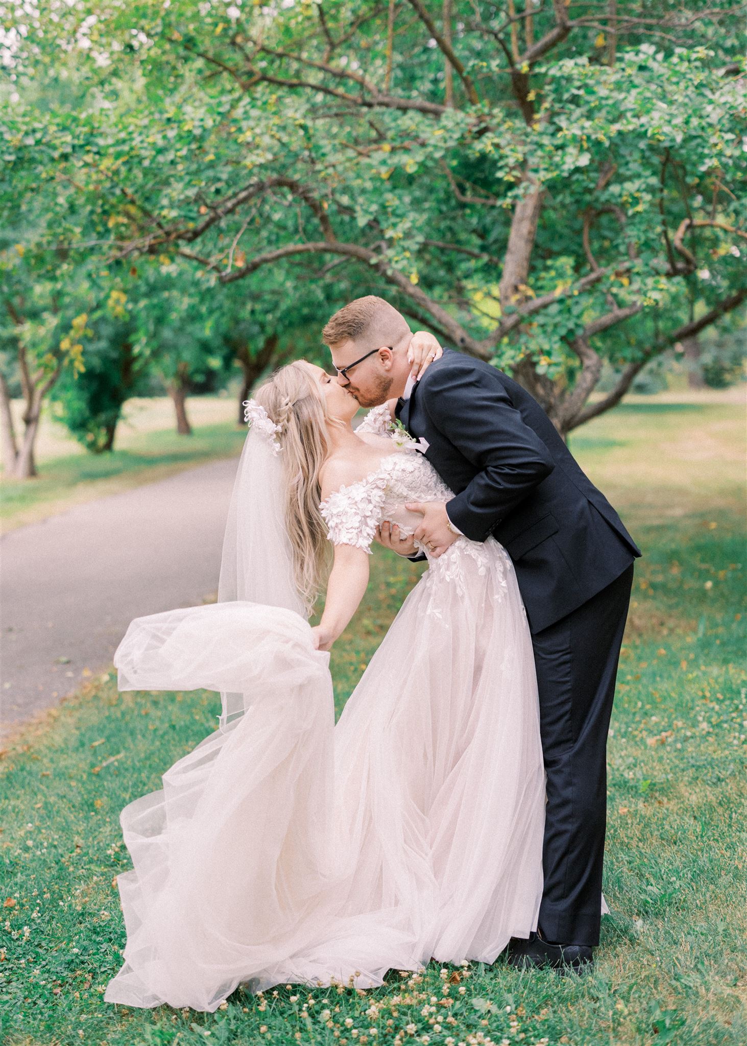 Waterfront Park Summer Calgary Wedding, lace wedding dress, nicole sarah, film wedding photography, film wedding photos, luxury wedding photographer calgary, romantic wedding portraits, alberta wedding photographers, lush greenery wedding photography, bride groom poses