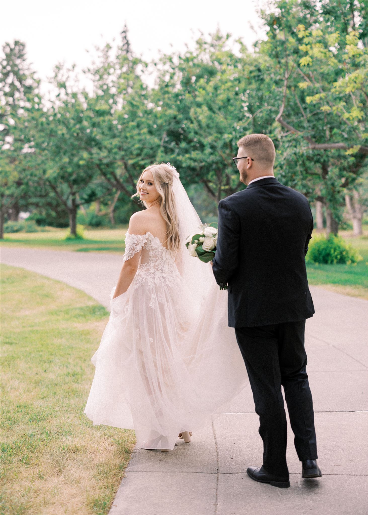 Waterfront Park Summer Calgary Wedding, lace wedding dress, nicole sarah, film wedding photography, film wedding photos, luxury wedding photographer calgary, romantic wedding portraits, alberta wedding photographers, lush greenery wedding photography, bride groom poses