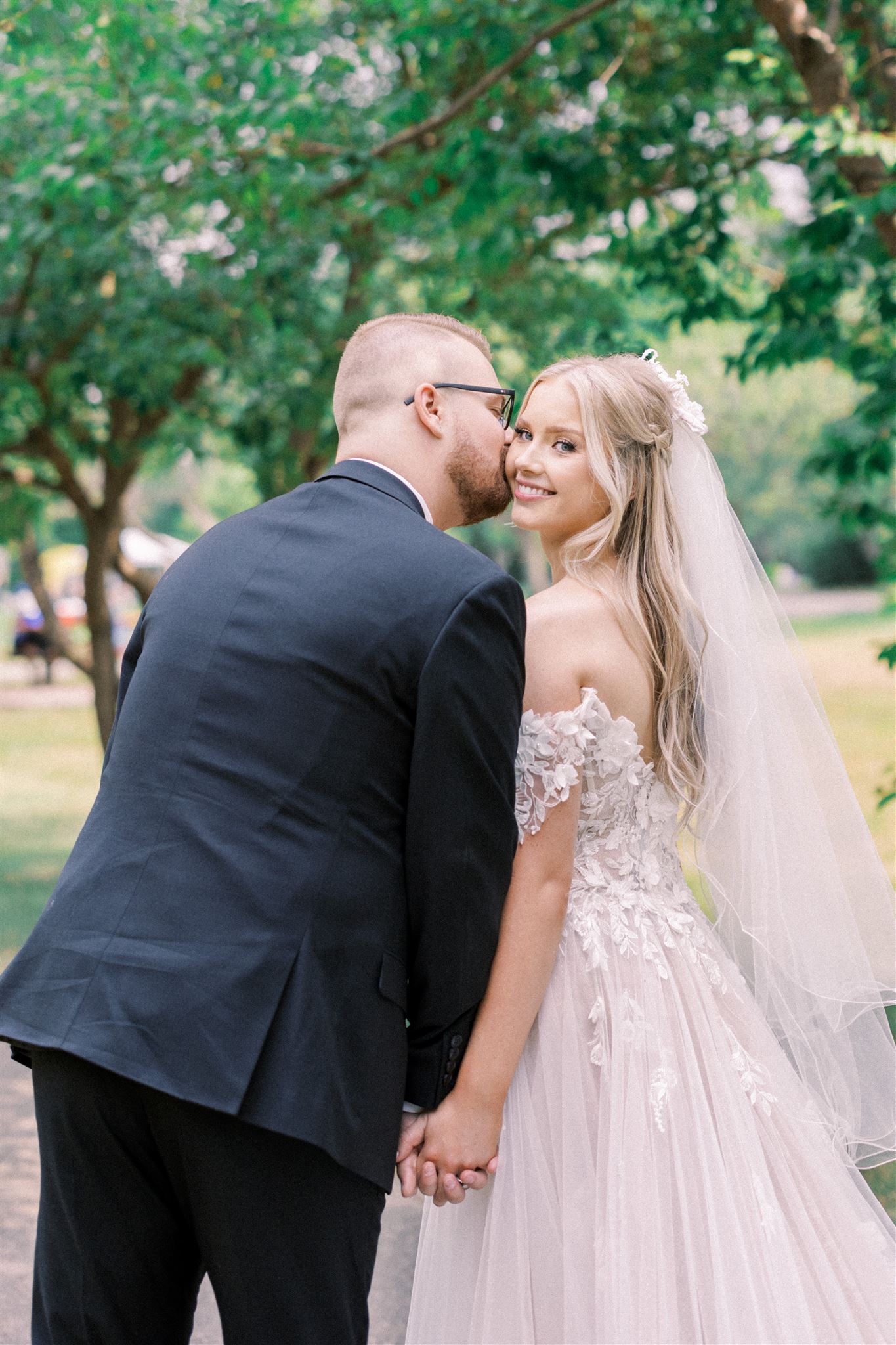 Waterfront Park Summer Calgary Wedding, lace wedding dress, nicole sarah, film wedding photography, film wedding photos, luxury wedding photographer calgary, romantic wedding portraits, alberta wedding photographers, lush greenery wedding photography, bride groom poses