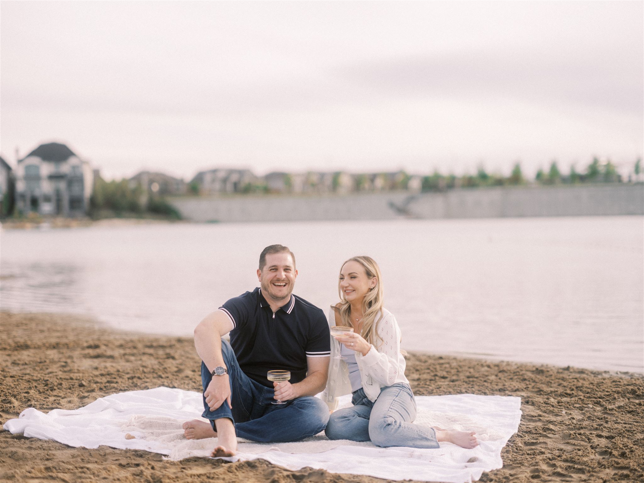 beach engagement, summer engagement, cute summer engagement, sunset engagement on the beach, nicole sarah, couple cuddling on the beach, summer beach engagement outfits, engagement poses beach, running on the beach engagement