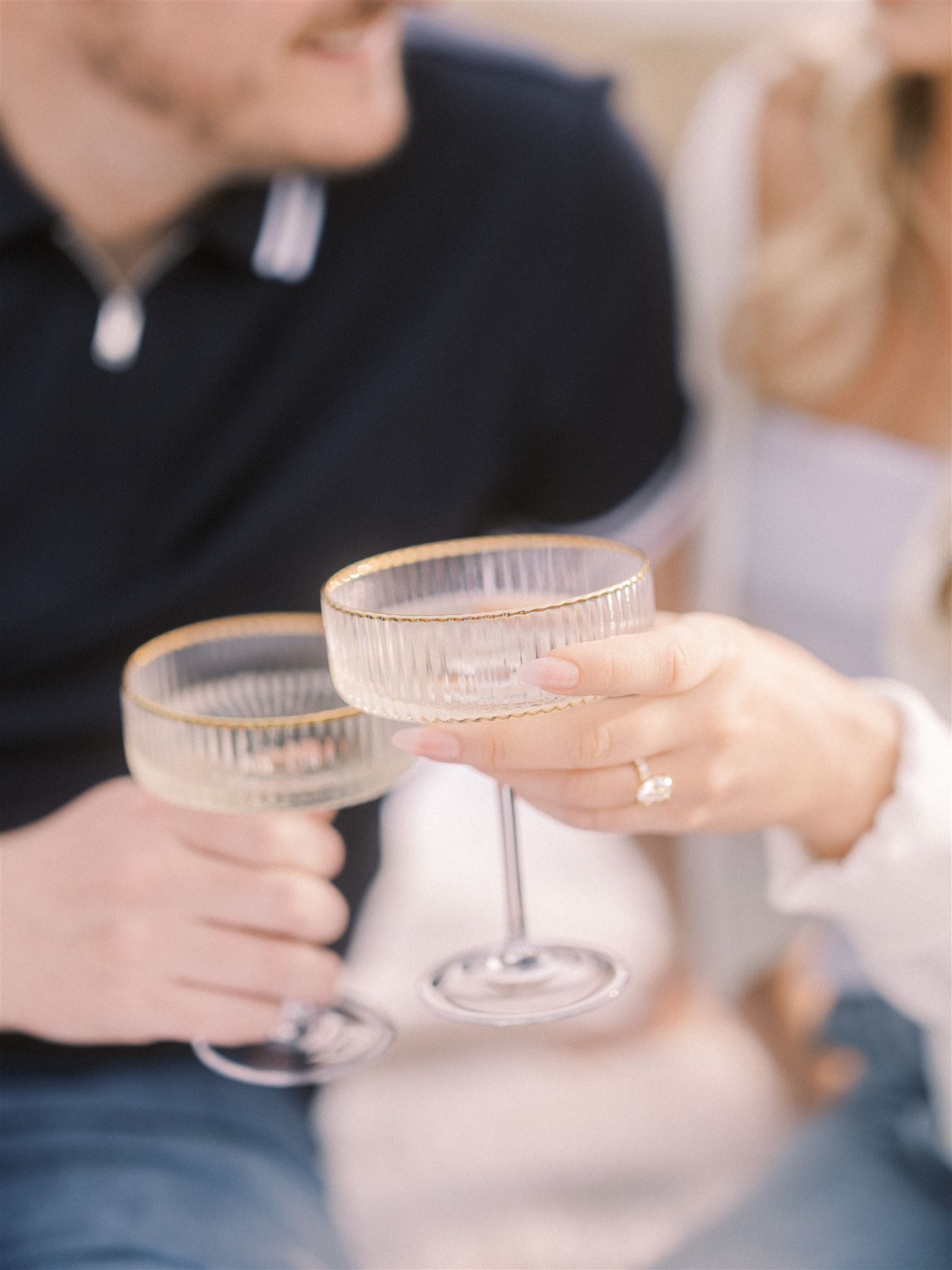 beach engagement, summer engagement, cute summer engagement, sunset engagement on the beach, nicole sarah, couple cuddling on the beach, summer beach engagement outfits, engagement poses beach, running on the beach engagement, couple clinking glasses, coupe glasses toast