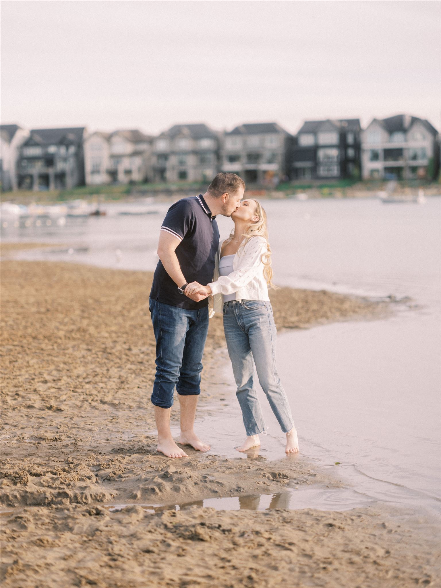 beach engagement, summer engagement, cute summer engagement, sunset engagement on the beach, nicole sarah, couple cuddling on the beach, summer beach engagement outfits, engagement poses beach, running on the beach engagement