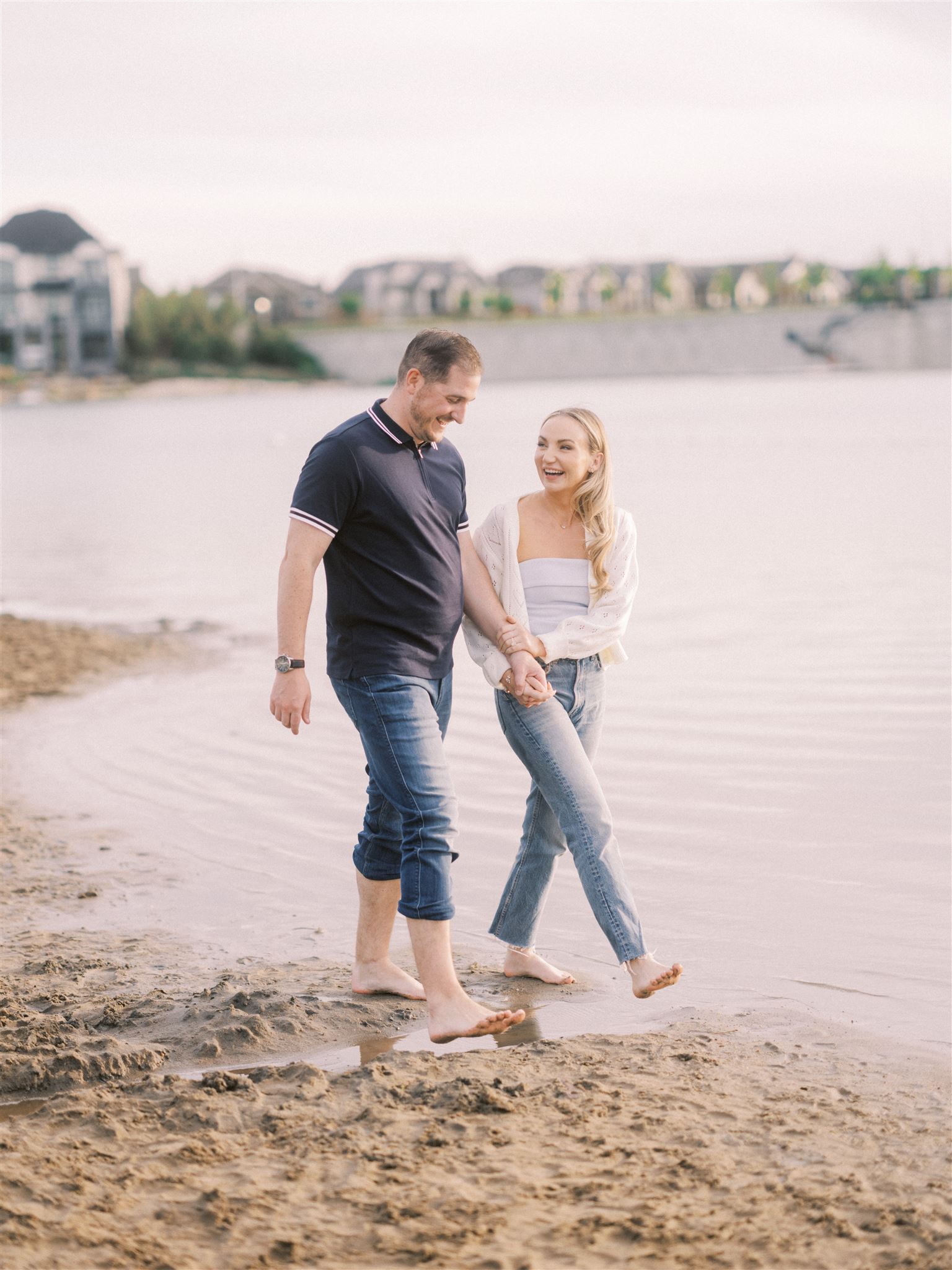 beach engagement, summer engagement, cute summer engagement, sunset engagement on the beach, nicole sarah, couple cuddling on the beach, summer beach engagement outfits, engagement poses beach, running on the beach engagement