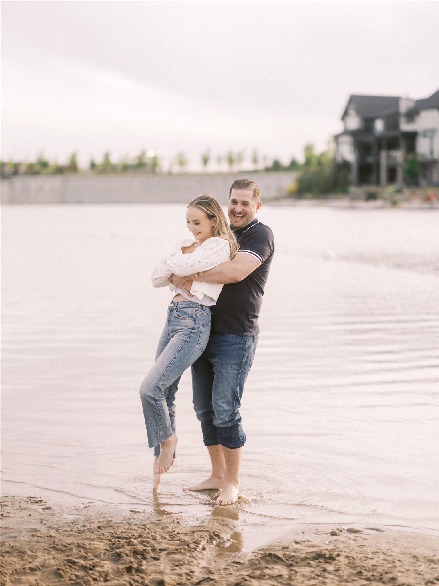 beach engagement, summer engagement, cute summer engagement, sunset engagement on the beach, nicole sarah, couple cuddling on the beach, summer beach engagement outfits, engagement poses beach, running on the beach engagement