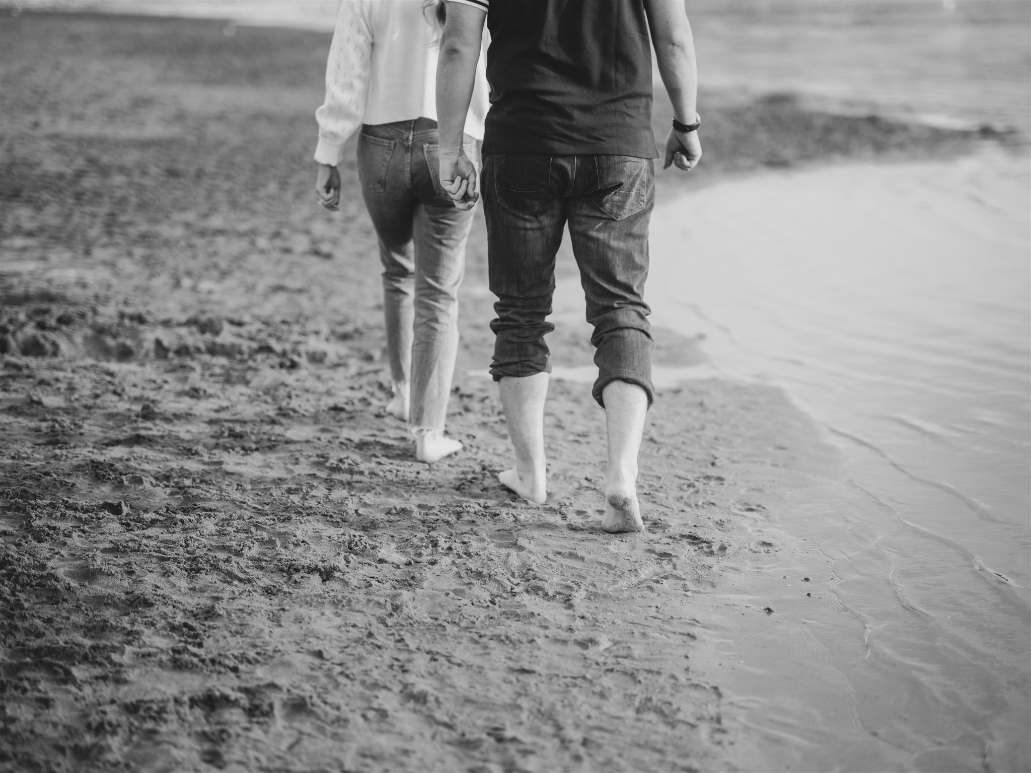 beach engagement, summer engagement, cute summer engagement, sunset engagement on the beach, nicole sarah, couple cuddling on the beach, summer beach engagement outfits, engagement poses beach, running on the beach engagement