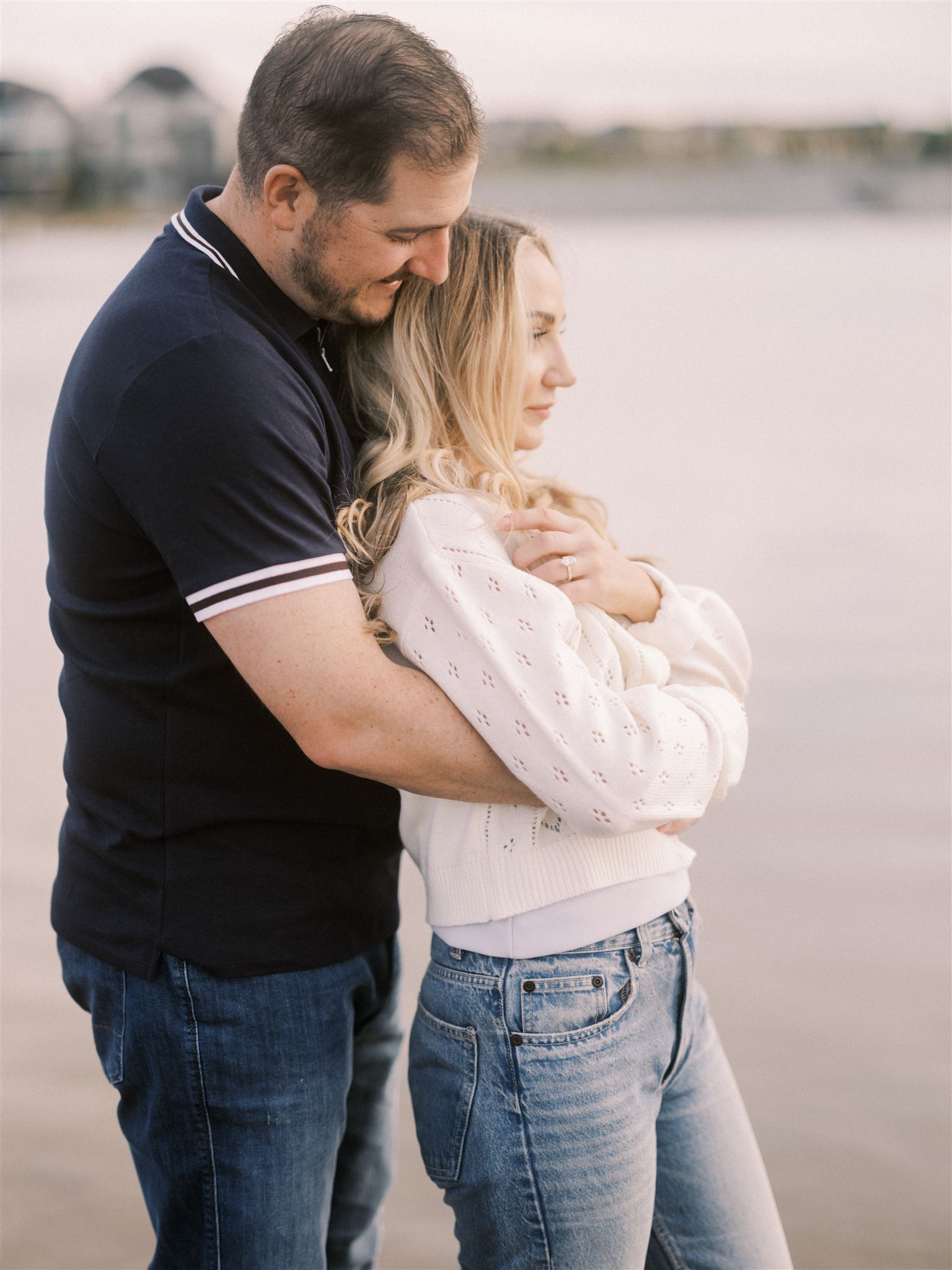 beach engagement, summer engagement, cute summer engagement, sunset engagement on the beach, nicole sarah, couple cuddling on the beach, summer beach engagement outfits, engagement poses beach, running on the beach engagement