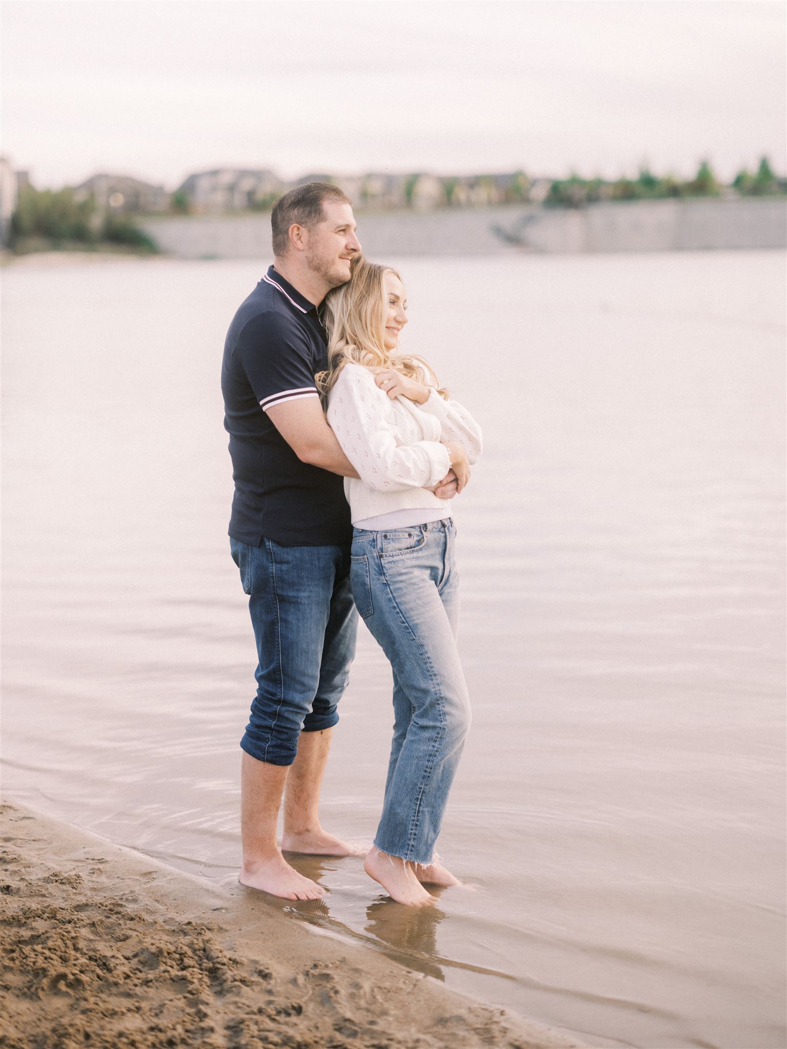 beach engagement, summer engagement, cute summer engagement, sunset engagement on the beach, nicole sarah, couple cuddling on the beach, summer beach engagement outfits, engagement poses beach, running on the beach engagement