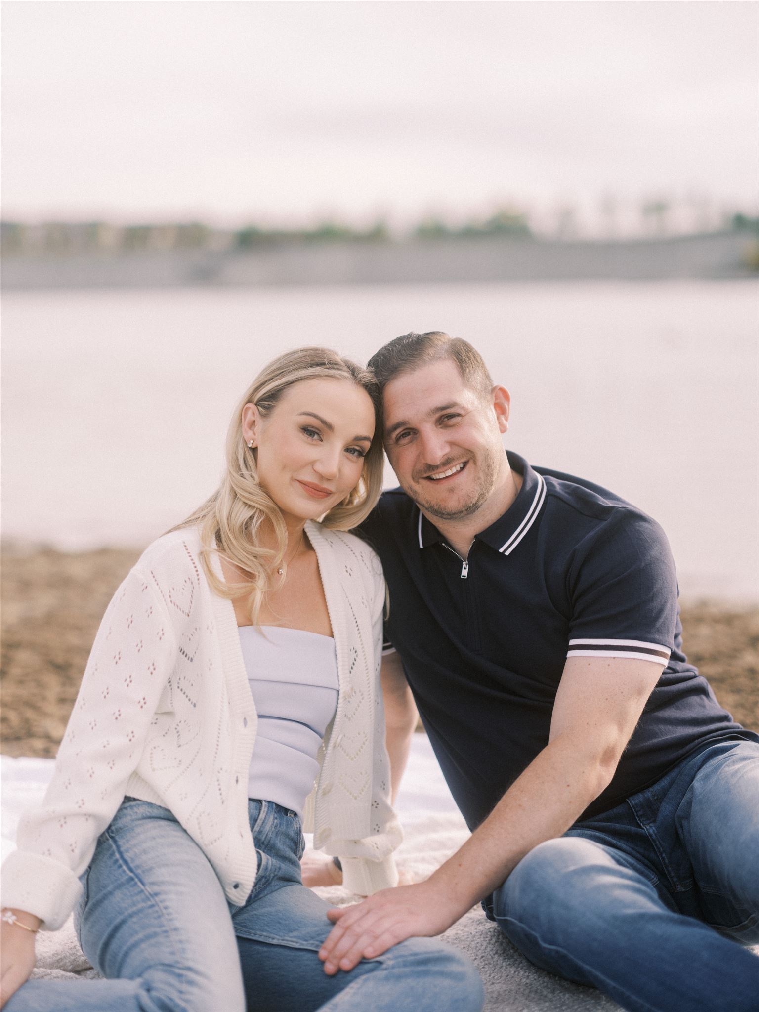 Summer Beach Engagement Calgary, beach engagement, summer engagement, cute summer engagement, sunset engagement on the beach, nicole sarah, couple cuddling on the beach, summer beach engagement outfits, engagement poses beach, running on the beach engagement