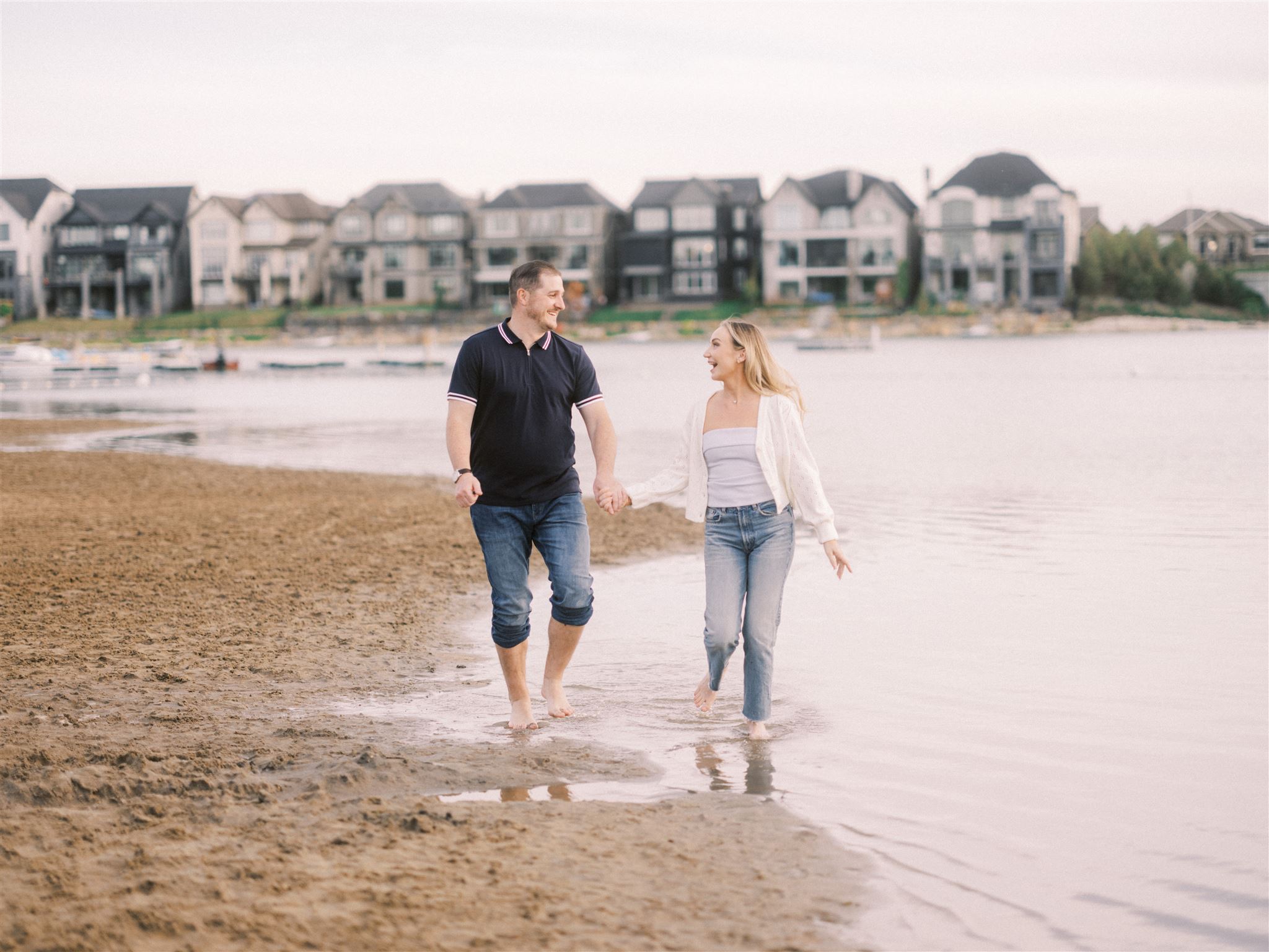 beach engagement, summer engagement, cute summer engagement, sunset engagement on the beach, nicole sarah, couple cuddling on the beach, summer beach engagement outfits, engagement poses beach, running on the beach engagement